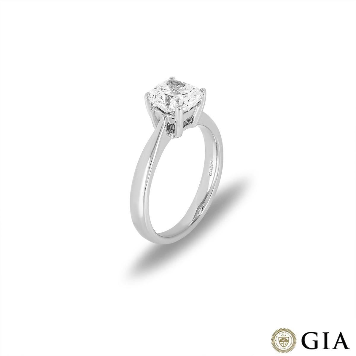A beautiful 18k white gold diamond solitaire ring. The ring is set to the centre with a cushion modified brilliant cut diamond weighing 1.66ct, I colour and VS1 clarity. The 3mm white gold band tapers up into a classic four claw setting. The ring
