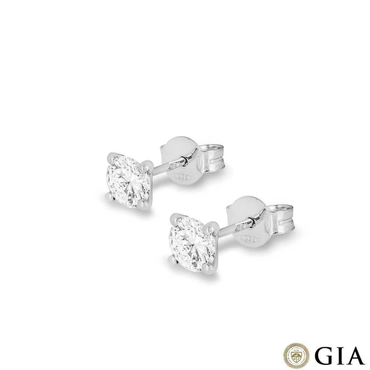 A sparkly pair of 18k white gold diamond stud earrings. The earrings feature round brilliant cut diamonds in a 4 claw setting. The first round brilliant cut diamond weighs 0.53ct, G colour and VS2 clarity. The second round brilliant cut diamond