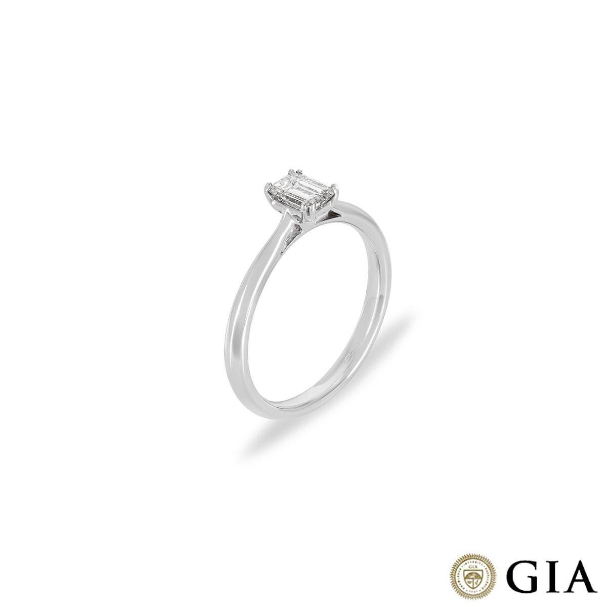 A captivating 18k white gold diamond engagement ring. The solitaire features an emerald cut diamond weighing 0.43ct, E colour and VS2 clarity. The ring tapers from 1mm to 2mm in width, has a gross weight of 2.70 grams and is currently a UK size M½/