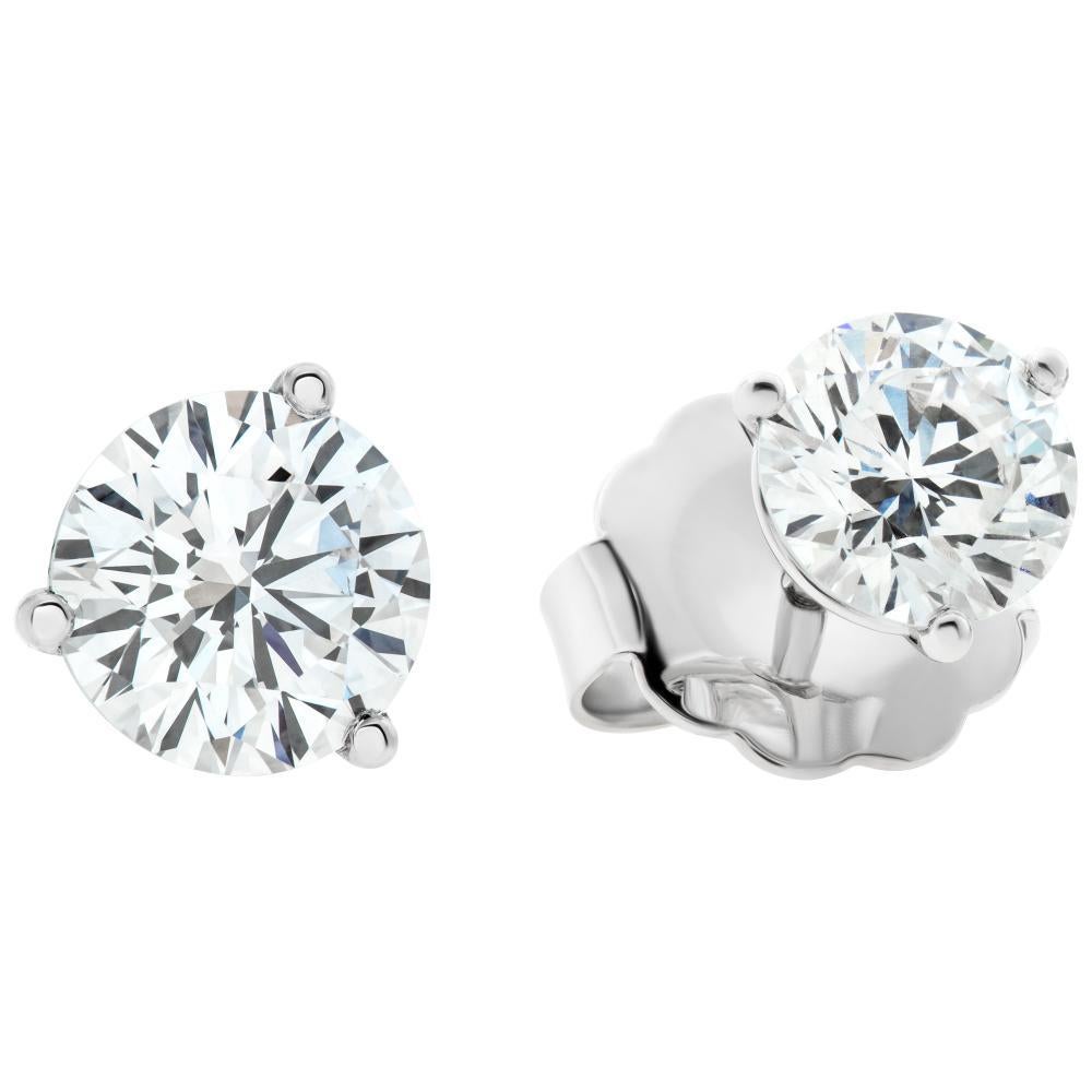 GIA Certified pair of round brilliant cut diamond studs 1.01 carat (each) E color, VVS2 clarity, set in 18K white gold 