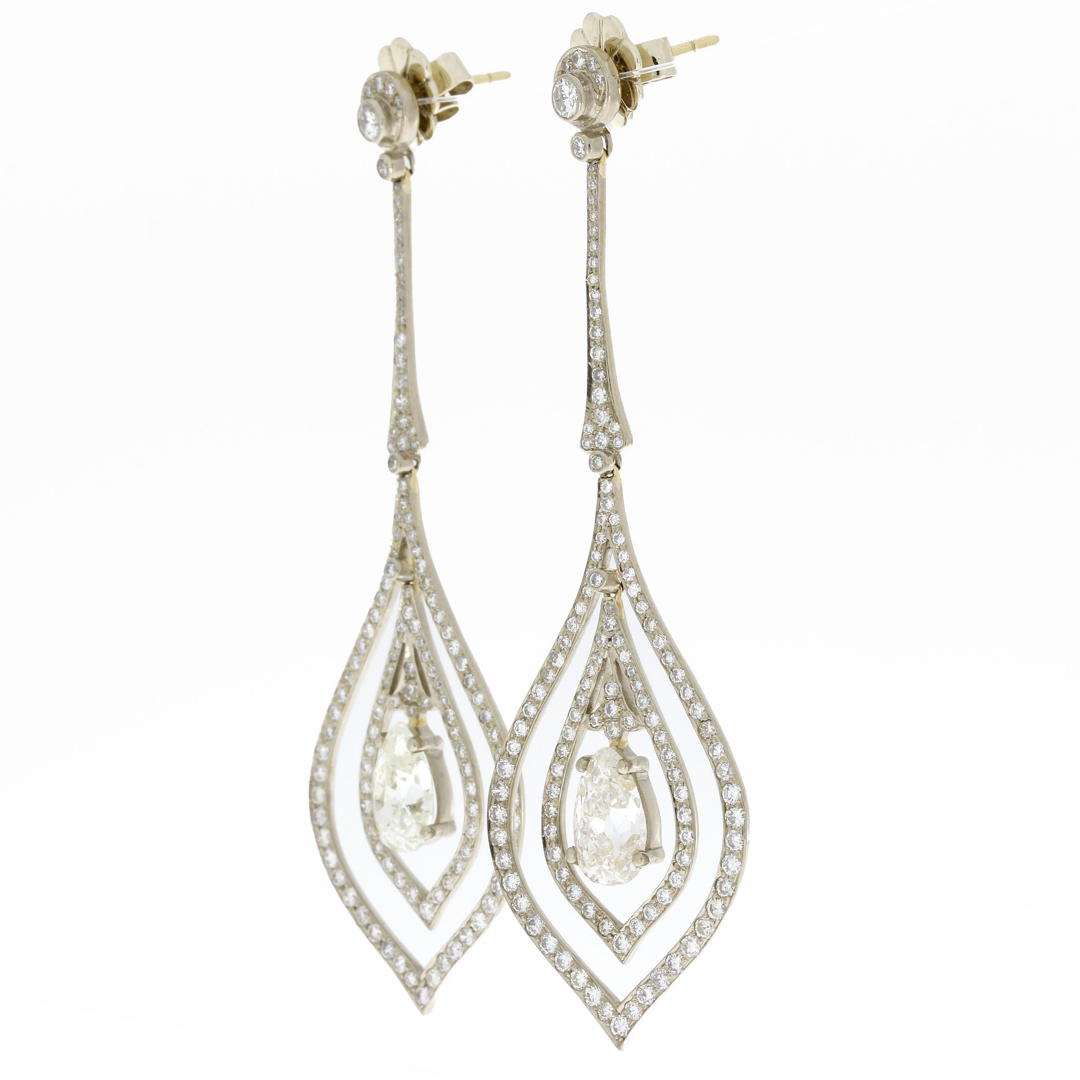 GIA Certified 18k White Gold Pear Shaped Diamond Earrings
Pear Shape 1.64 carat / Color J / Clarity I1
Pear Shape 1.67 carat / Color K / Clarity SI1
approx. 2.5 carat additional Diamonds