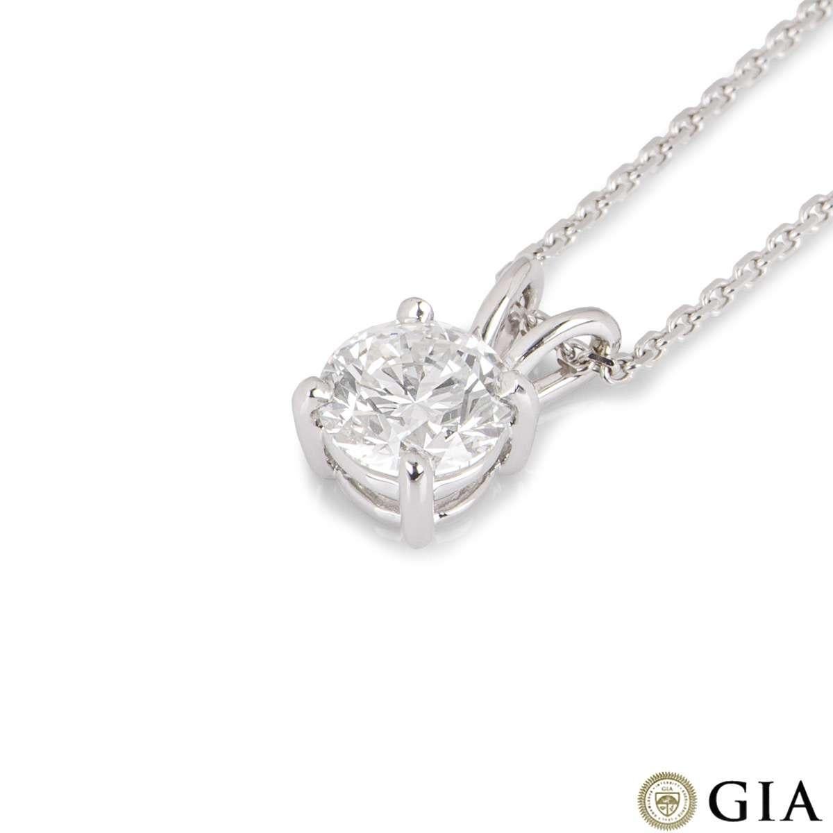 An 18k white gold diamond pendant. The pendant is set with a single round brilliant cut diamond weighing 1.23ct, F colour and SI1 clarity. The diamond scores an excellent rating in all three aspects for cut, polish and symmetry - this is known as a