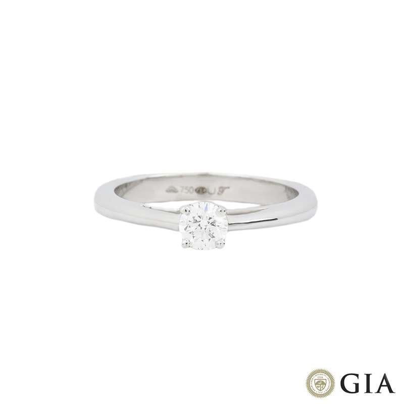 An elegant 18k white gold diamond single stone solitaire ring. The ring is set to the centre with a 0.30ct round brilliant cut diamond, E colour and VS1 clarity and scores an excellent rating in cut, polish and symmetry - this is known as a triple