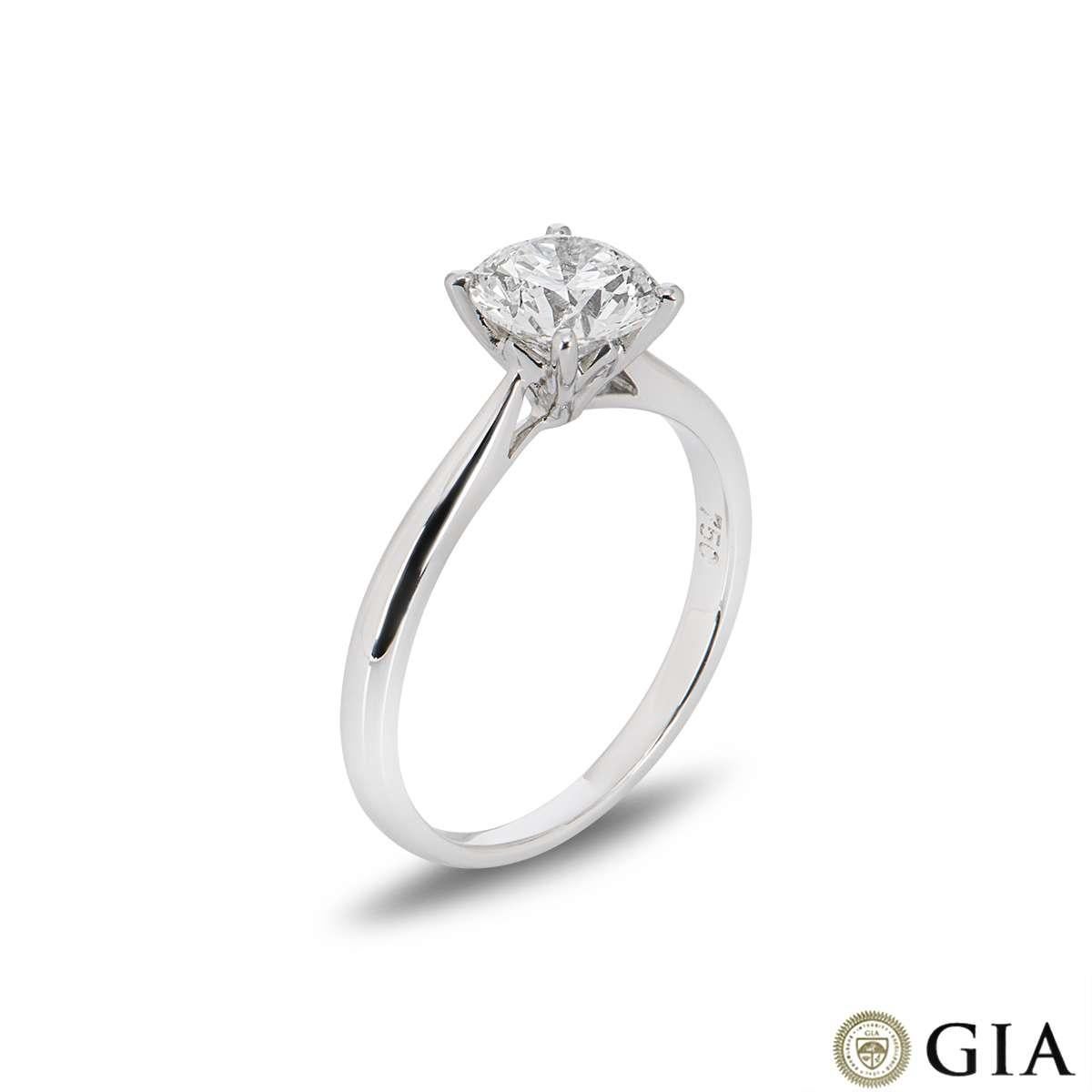 A beautiful 18k white gold diamond single stone ring. The ring is set to the centre with a 1.15ct round brilliant cut diamond, F in colour and VS1 in clarity in a classic four claw setting. The diamond scores an excellent rating in all three aspects