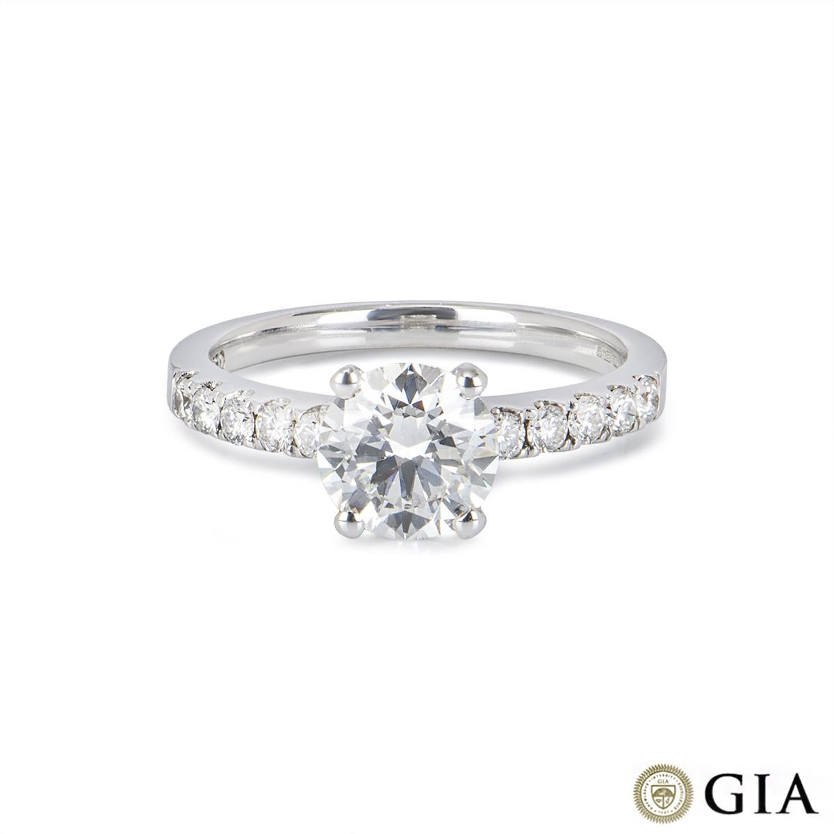 A gorgeous 18k white gold diamond engagement ring. The ring is set to the centre with a round brilliant cut diamond weighing 1.23ct, H colour, VS1 clarity and scores an excellent rating in all three aspects for cut, polish and symmetry- this is