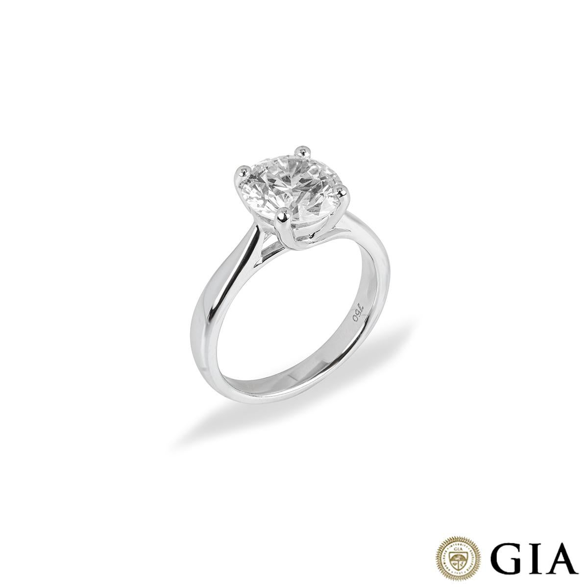 A beautiful 18k white gold diamond engagement ring. The solitaire ring comprises of a round brilliant cut diamond in a four claw setting with a weight of 2.71ct, M colour and VS2 clarity. The diamond scores an excellent rating in all three aspects