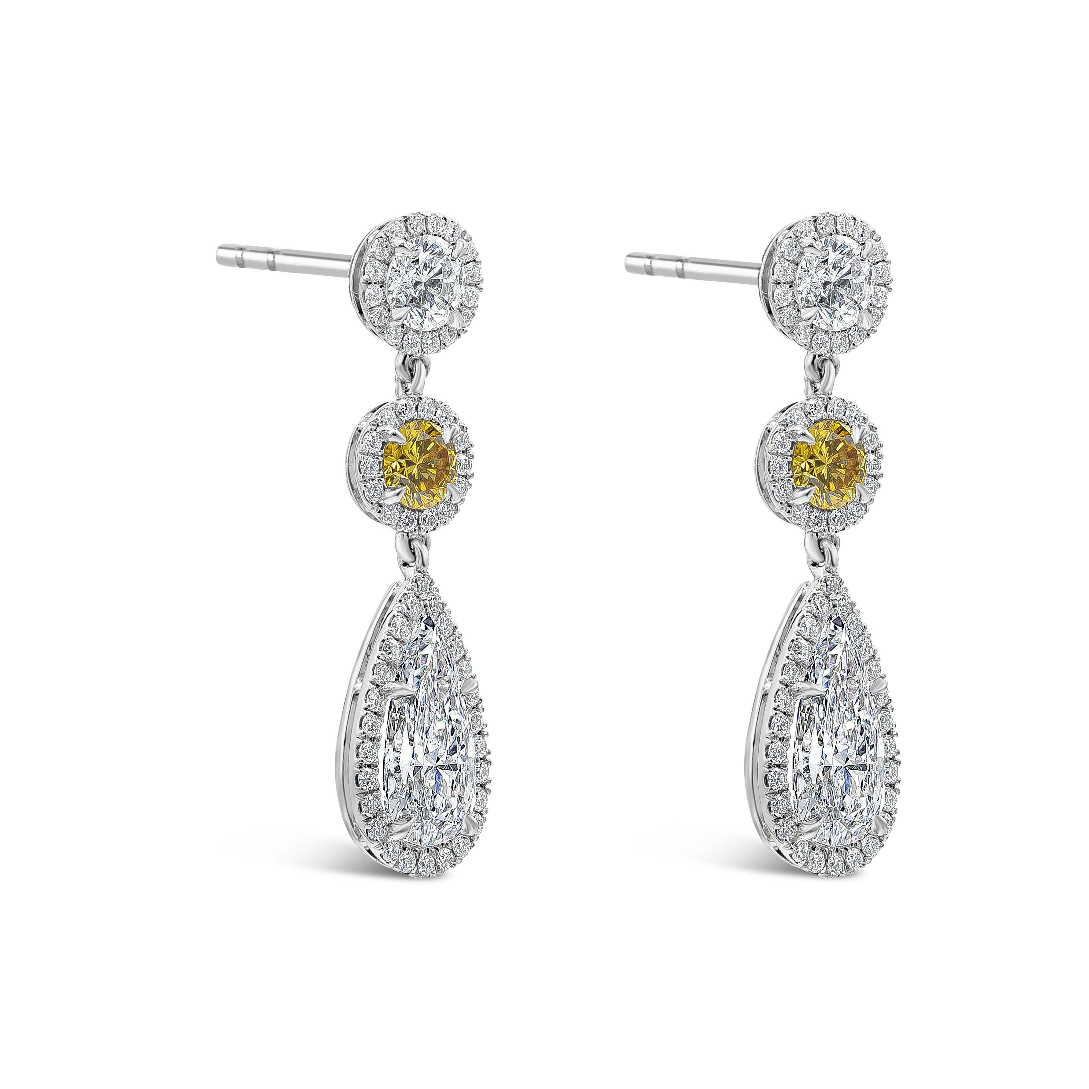 This stunning dangle earrings features two GIA Certified pear shape diamonds weighing 2.07 carats total, D Color and Si1 in Clarity. Two GIA Certified round cut fancy intense yellow diamond weighing 0.41 carats total. Suspended on a round brilliant