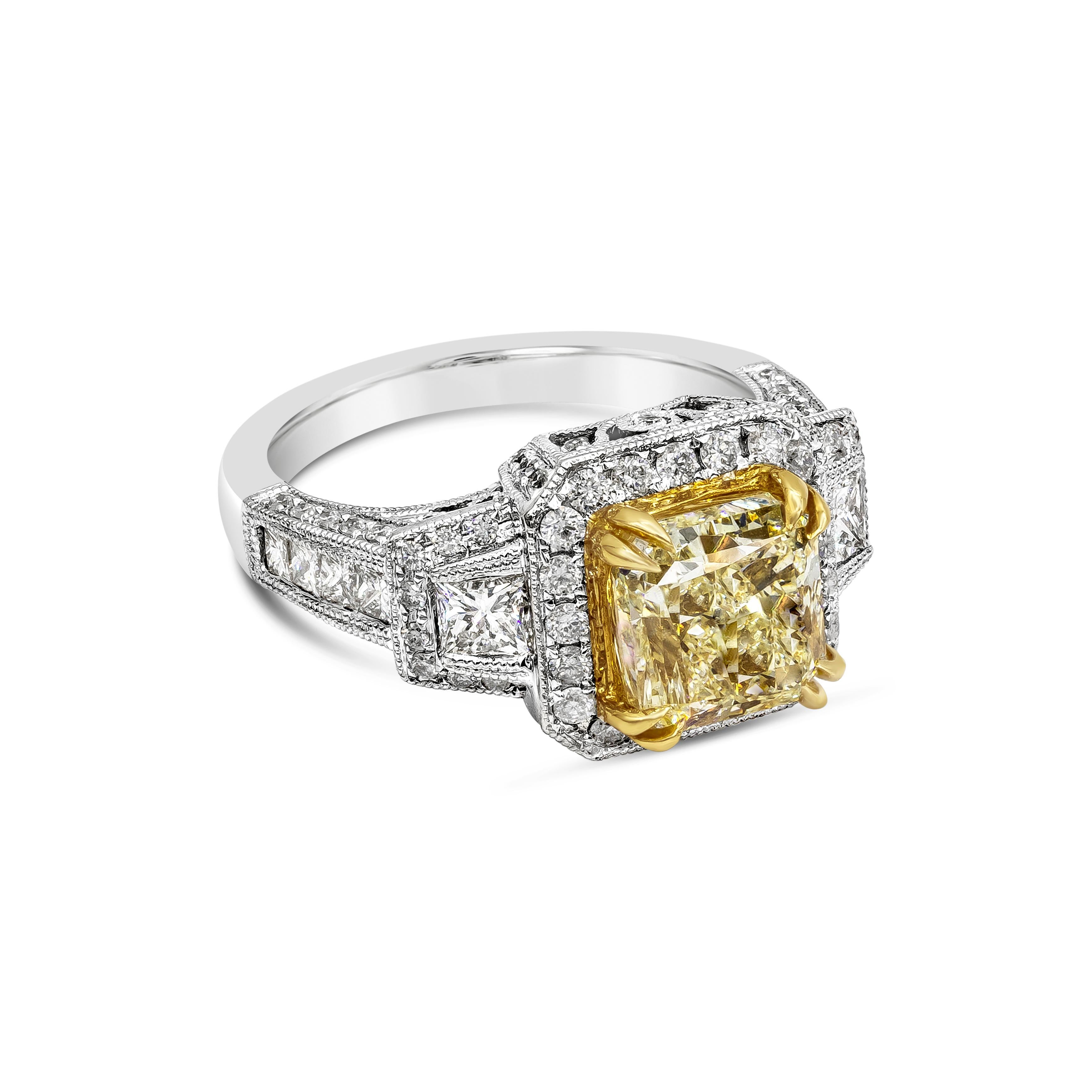 An antique style engagement ring, showcasing a 3.40 carat radiant cut yellow diamond certified by GIA as Y-Z Color and SI1 clarity, set in eight prong 18K yellow gold. Surrounded by round diamonds in halo setting and accented by two brilliant