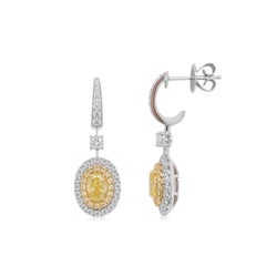 Orecchini pendenti in oro 18 carati con diamante giallo ovale certificato GIA e diamante bianco
