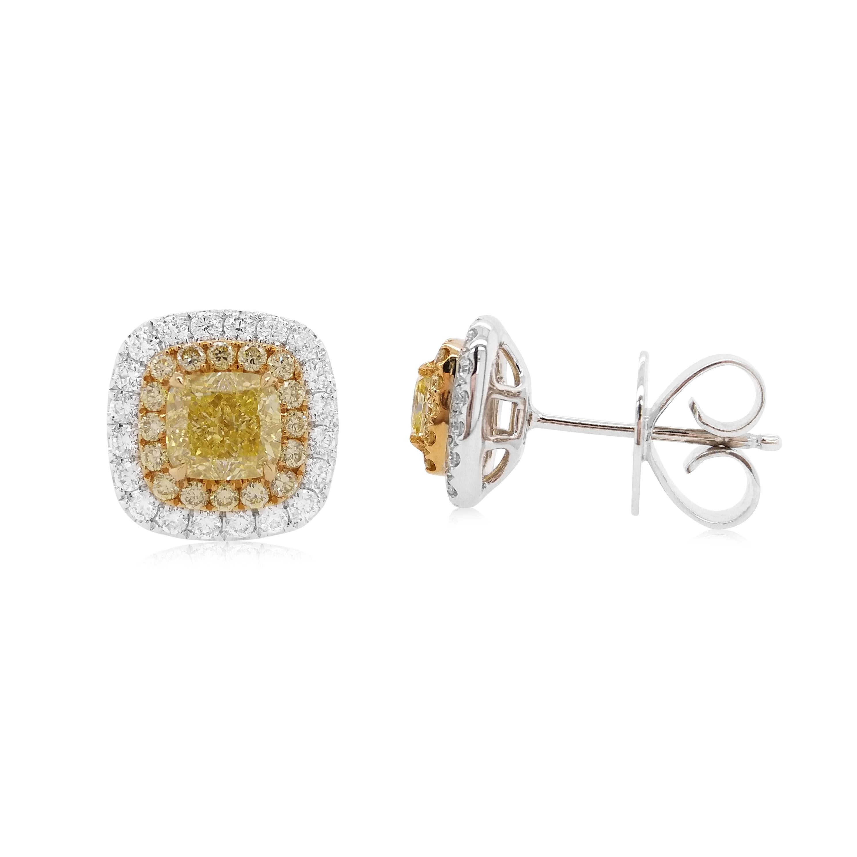 These classic earrings feature lustrous cushion-shaped Yellow diamonds at the centre of the design, with a subtle yellow diamond and white diamond halos surrounding them. Set in 18 Karat white gold to enrich the incredible hue of the yellow diamond