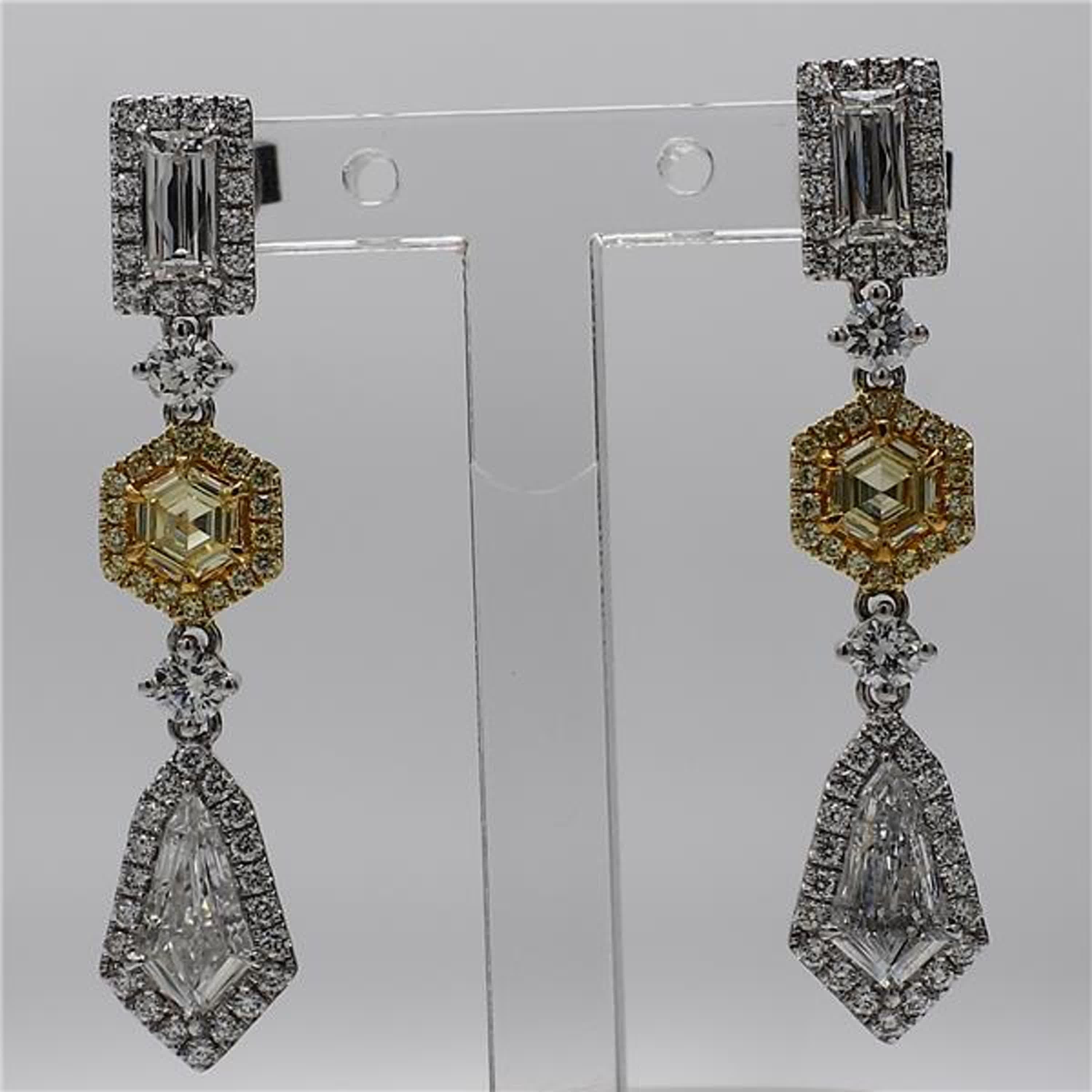 RareGemWorld's intriguing GIA certified diamond earrings. Mounted in a beautiful 18K Yellow and White Gold setting with natural yellow hexagon cut diamonds, white kite cut diamonds, and white baguette cut diamonds, all surrounded by natural round