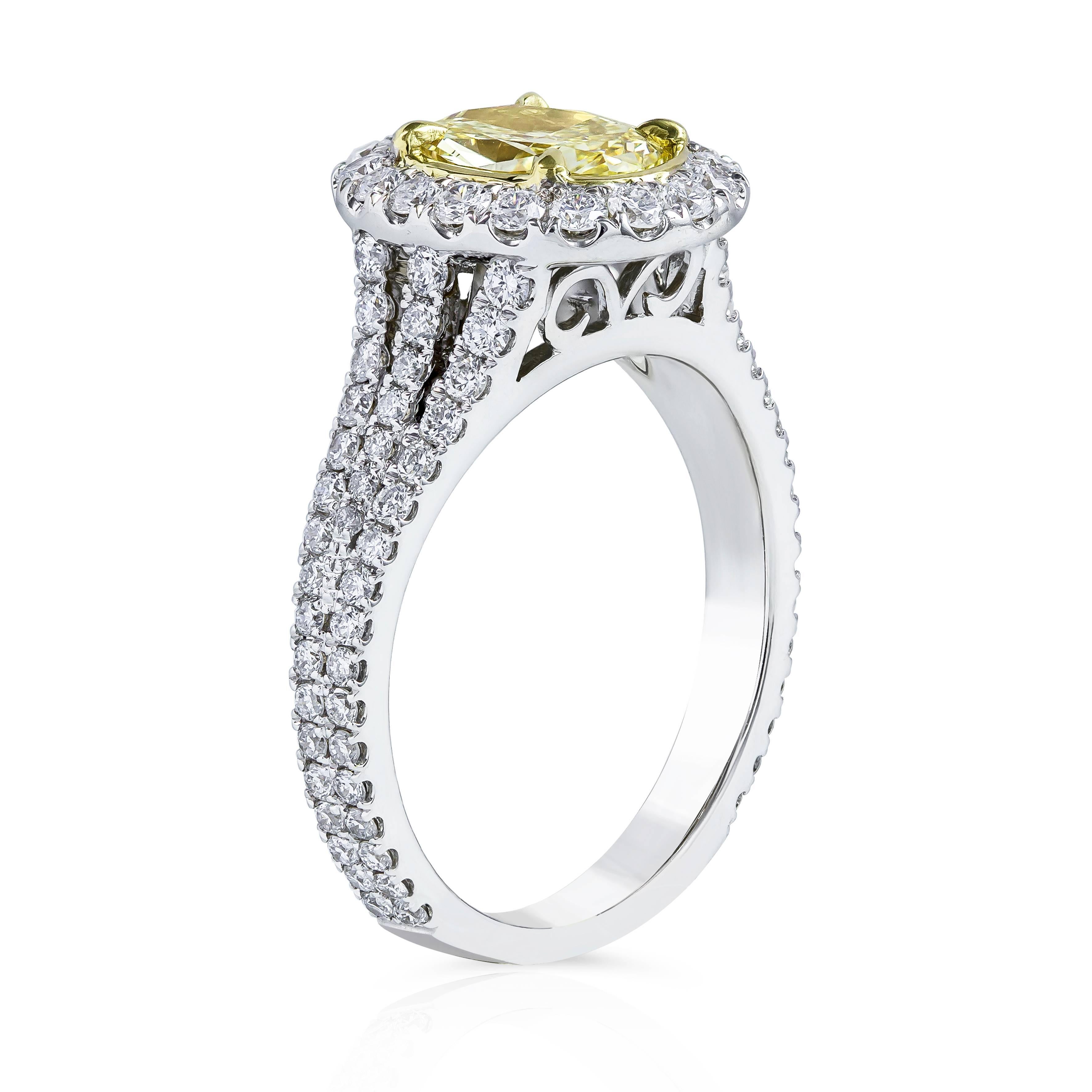 Part of our yellow diamond halo engagement rings collection, this ring features a vibrant 1.13 carat oval cut diamond center stone that GIA certified as Fancy Yellow color, VS2 clarity set in a diamond encrusted halo. Finished with an Intricately