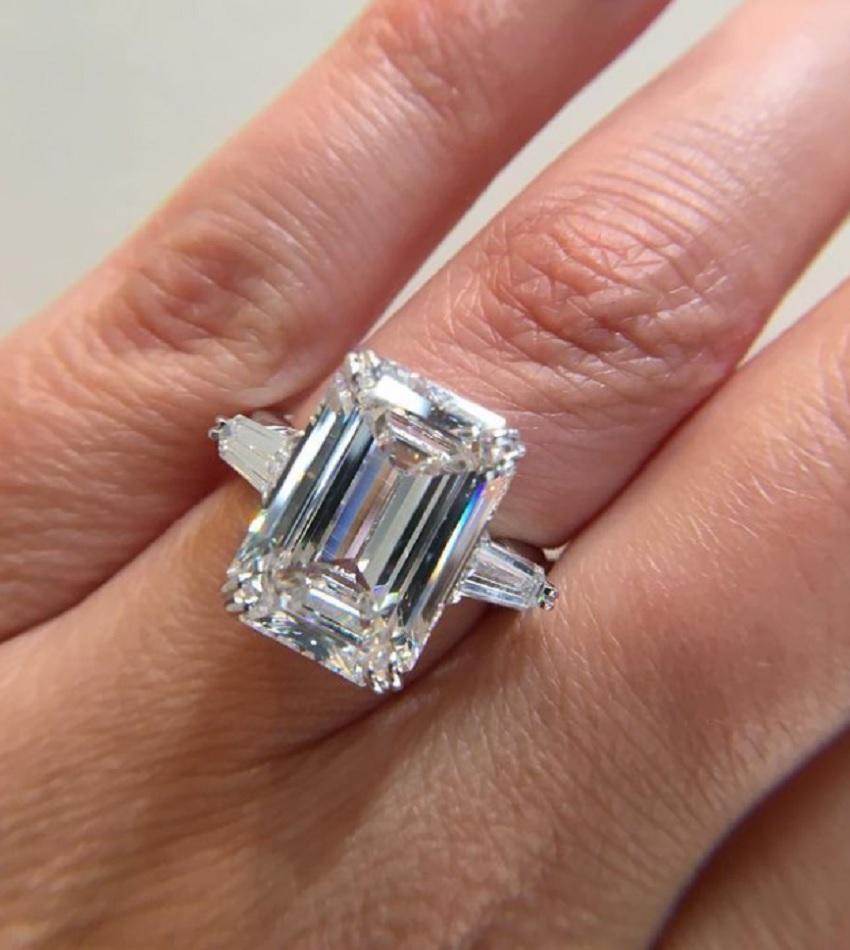 Contemporary GIA Certified 6.05 Carat Emerald Cut Diamond Three Stone Ring in Platinum For Sale