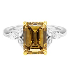 GIA Certifies 3 stone ring with 3.18ct Fancy Dark Brown Yellow VS2 Emerald Cut