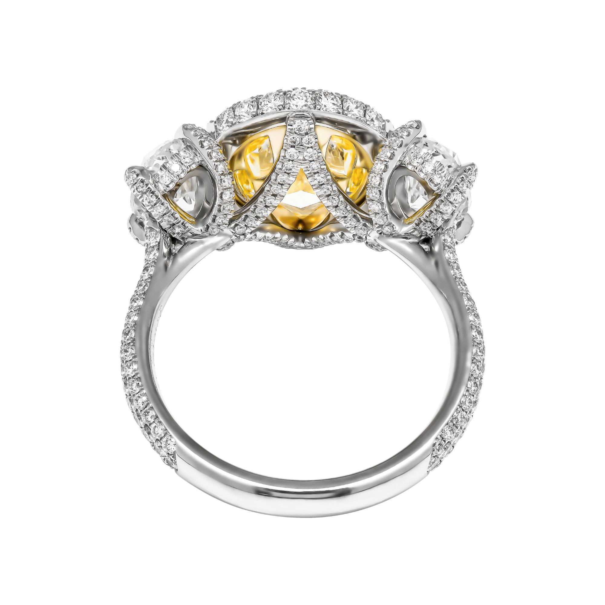 GIA Certifies 3-Stone Ring with 3.52 Carat Fancy Light Yellow Oval Diamond In New Condition For Sale In New York, NY