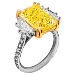 GIA Certifies 3 stone ring with 6.57ct Fancy Light Yellow Radiant Cut Diamond