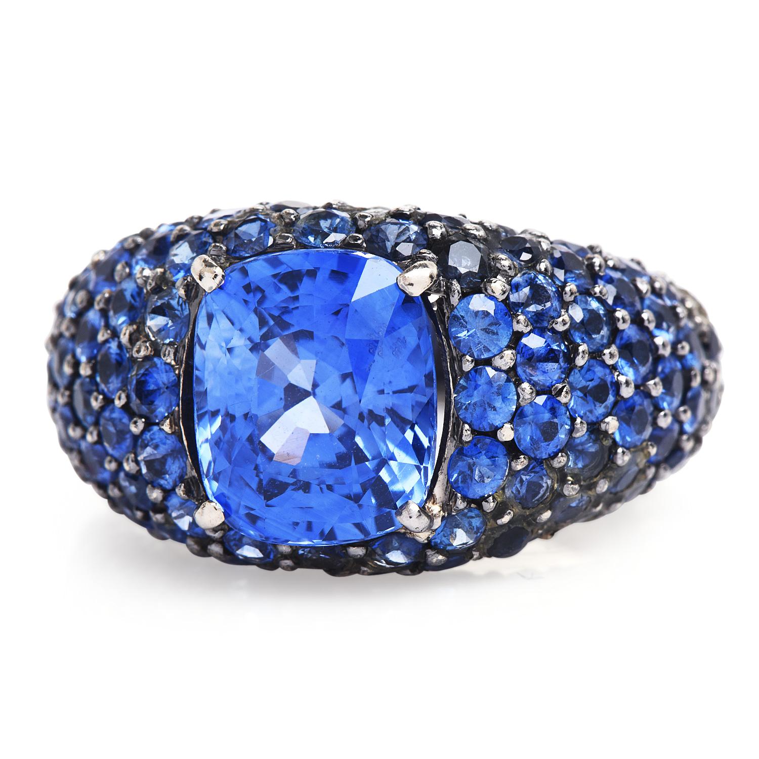 This beautiful, exquisite vivid & bright blue Sapphire & Diamond ring is covered in fine sapphire gemstones & centered by a genuine Sri Lankan sapphire.

Crafted in 18K White Gold with a Black Finish. 

An alluring Cushion Cut, GIA certified Blue