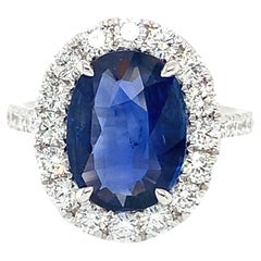 GIA Ceylon Sapphire 
Diamond Halo Ring in 18 Karat White Gold