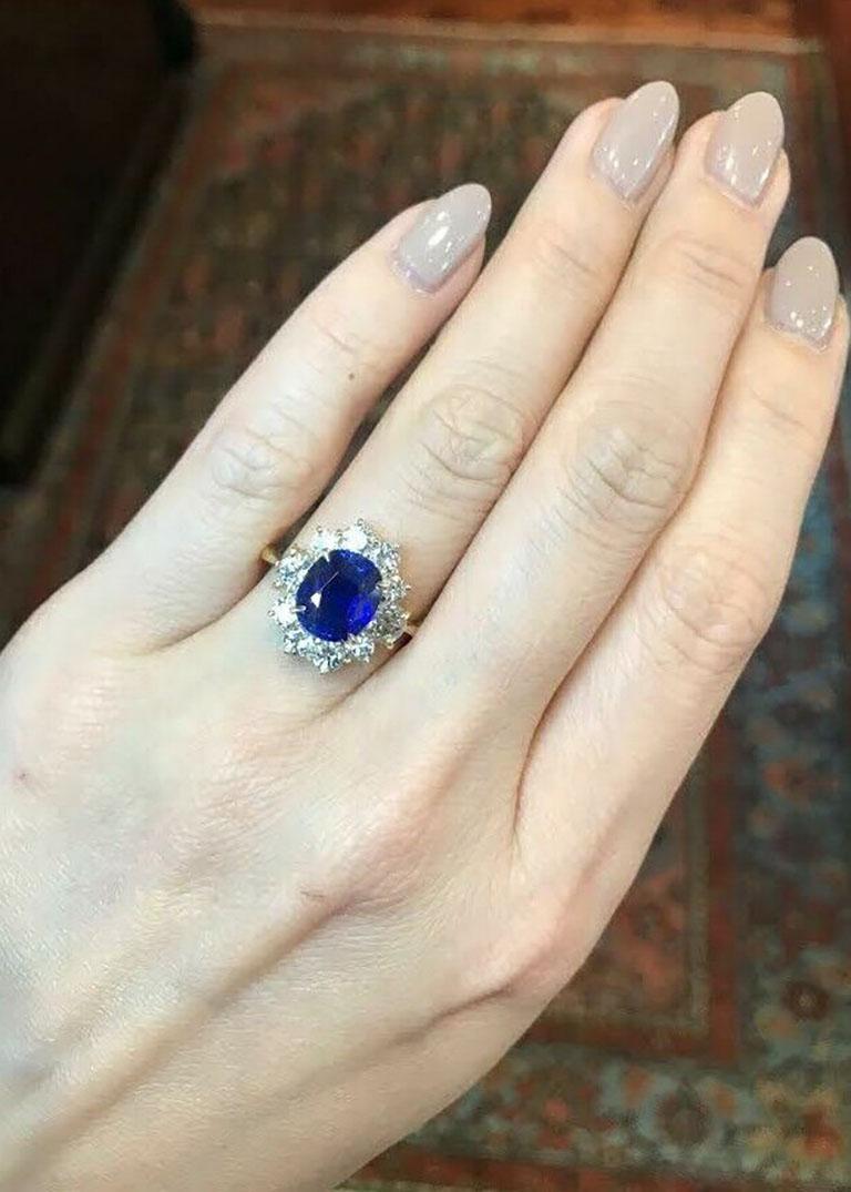 GIA Ceylon Unheated 3.95 carat Sapphire Ring with Diamonds in 18k Yellow Gold

Sapphire Ring with Diamonds features a deep blue Cushion cut Ceylon Sapphire center surrounded by Round Brilliant Diamonds set in 18k Yellow Gold.

The Sapphire is