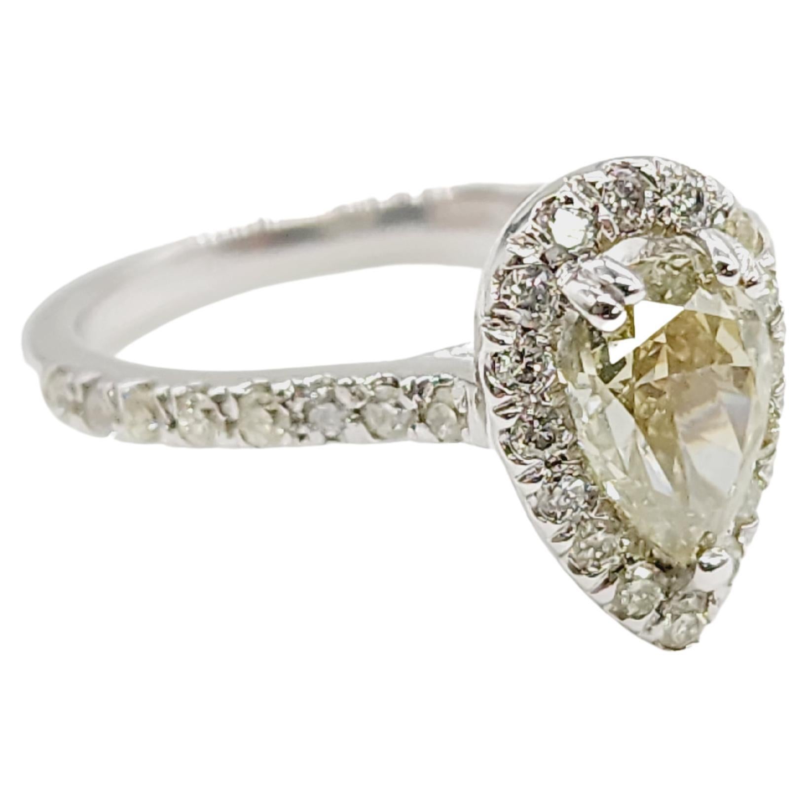 GIA CHAMELEON Fancy Brownish Greenish Yellow Pear Shape Natural Diamond Weighs 1.11 carats. 
Surrounded by paved white diamonds in the halo 14 karat white gold setting. 
Ring size 6.5