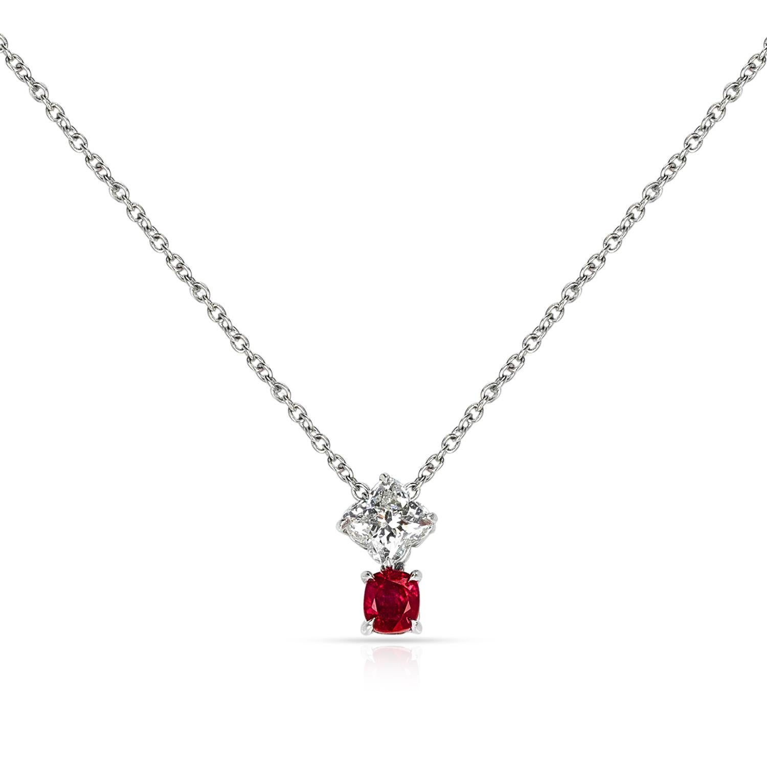 A Clover Shape Diamond and Oval Ruby Pendant Necklace made in Platinum. The diamond weighs 1.01 carats, and is certified by GIA stating that the color is K and the clarity is VVS1. 
