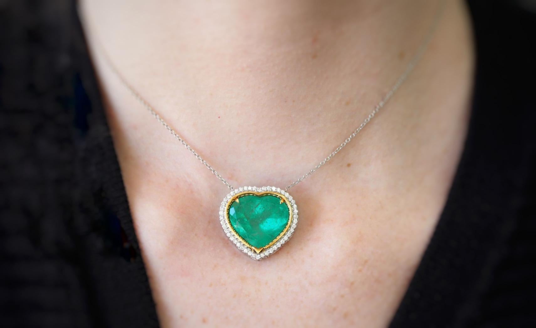 This tantalizing emerald heart pendant is certain to have you hypnotized. It was custom created by our incredible custom department team. The green heart Colombian emerald  measures 16.35mm X 18.22mm X 10.11mm, weighing 15.02 carats with a desired