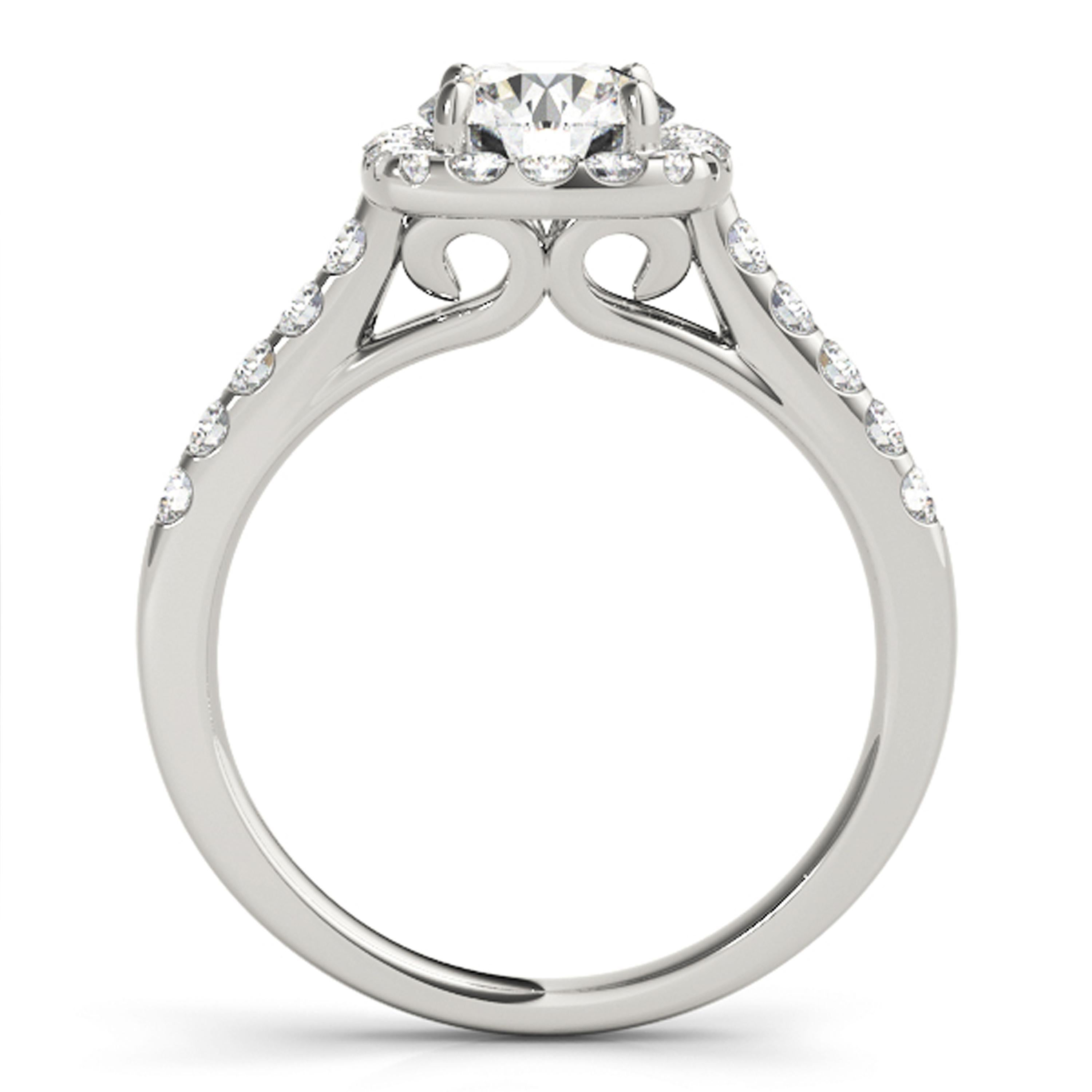 Shimmering diamonds full of life line the shank and surround the halo of this ScintilleNora one of a kind engagement ring. The GIA certified natural diamond is held gloriously in the center as it appears larger with the diamond accented halo.