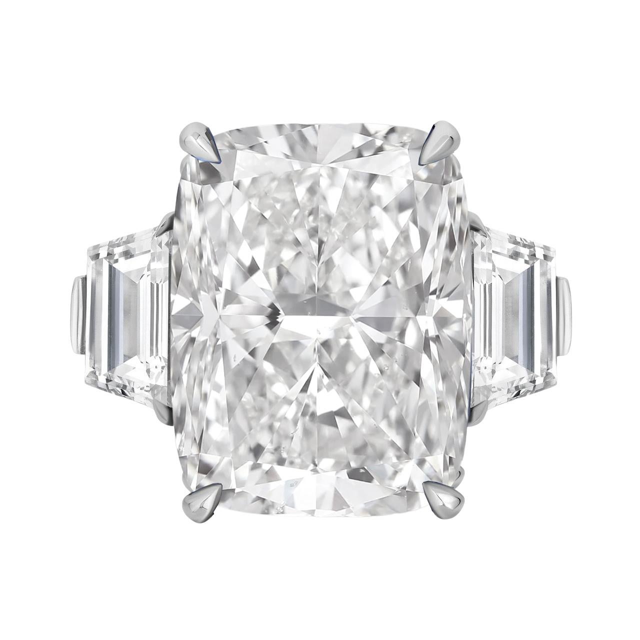 This remarkable engagement ring features a dazzling 8 carat cushion-cut diamond, certified by the Gemological Institute of America (GIA). Set in a sophisticated platinum band, this ring radiates timeless elegance and luxury. The centerpiece diamond