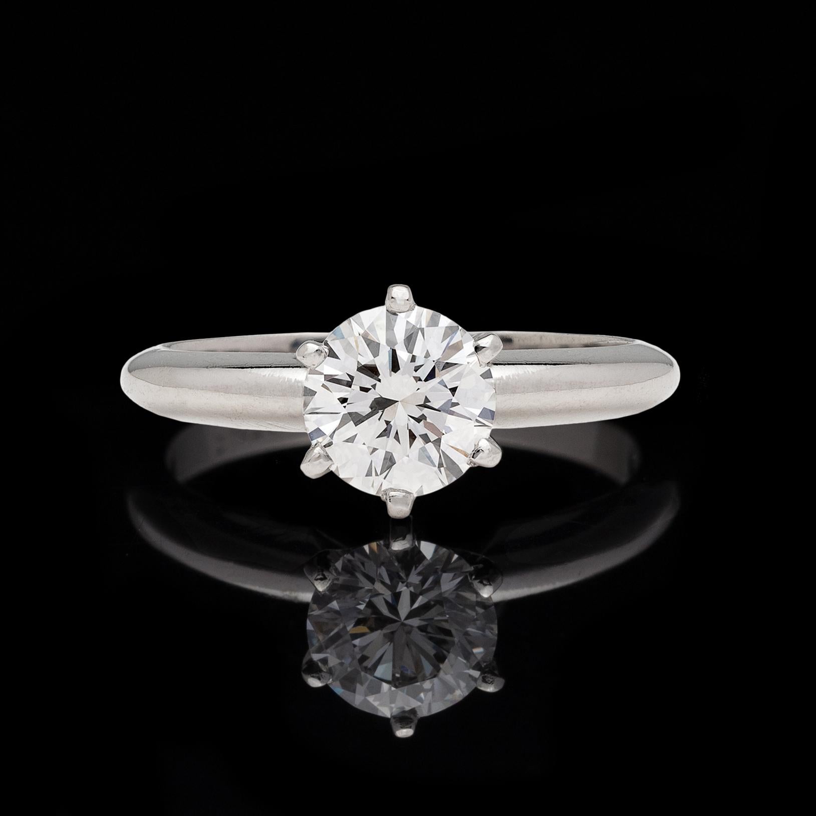 Give her the best of the best. This 1.02 carat round brilliant-cut diamond is GIA graded D color and VS2 clarity. Set in a 6-prong, classic platinum Tiffany-style mounting, the ring weighs 4.8 grams and is currently a size 5 3/4, with easy