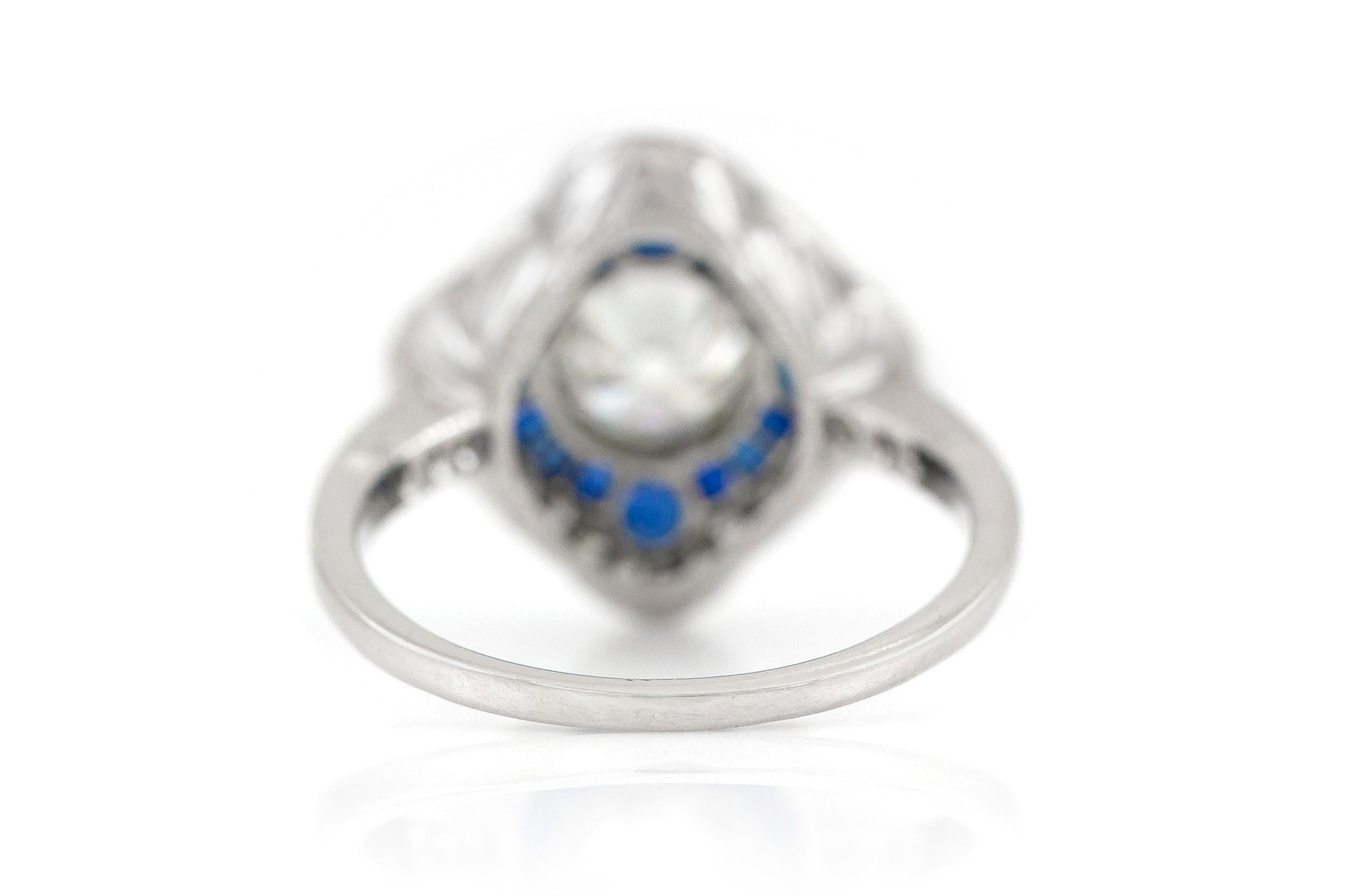 The rung is finely crafted in platinum.With GIA center dia weighing approximately total of 1.01.
Color J Clarity I1 .
All around diamonds weighing approximately total of 0.40 and sapphire 0.90 carat.