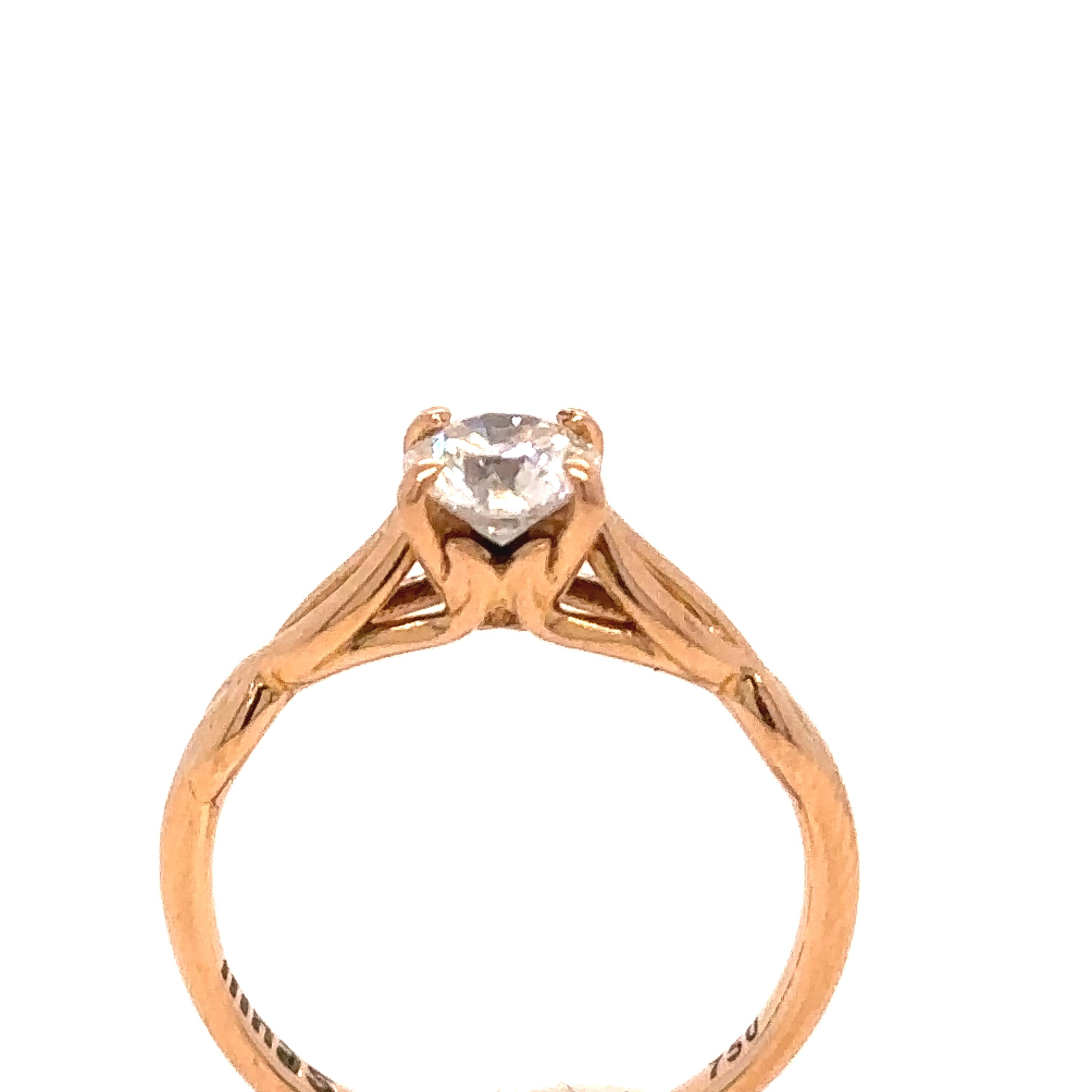 A GIA Diamond Engagement Solitaire Ring made of 18 carat Rose Gold.

Metal: 18ct Rose Gold
Carat: 0.62ct
Colour: F
Clarity: VS1
Cut: Round Brilliant Cut
Weight: N/A
Engravings/Markings: Signed NINAS 750

Size/Measurement: Ring Size M

Current
