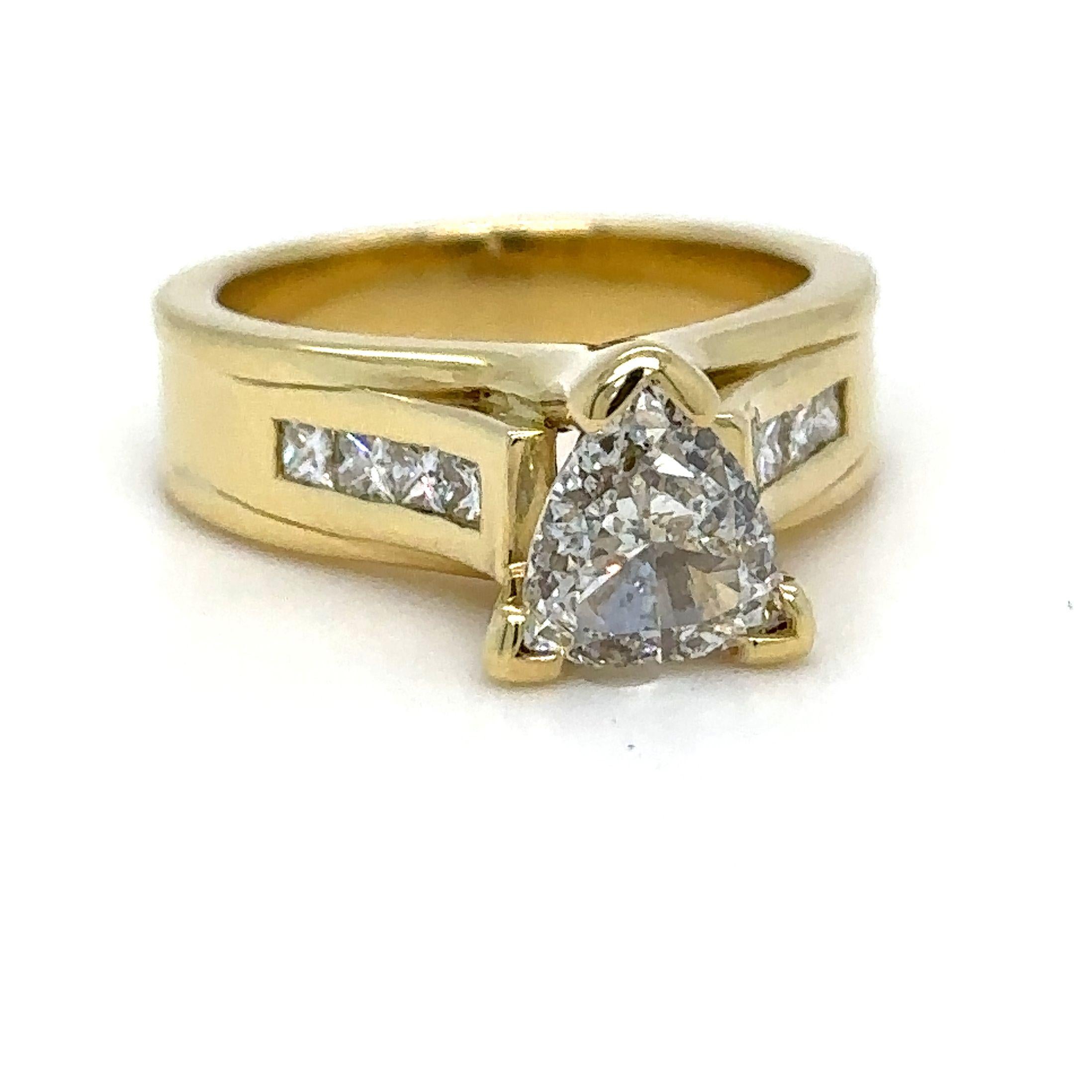 A Diamond engagement Ring, made of 18ct Yellow Gold, and ring size of M, and weighing 10gm. Stamped: 750.

Set with a Single Triangle, brilliant cut Diamond, colour G, and clarity SI1. Weighing 1.00 ct. Certificate provided from GIA. With Report