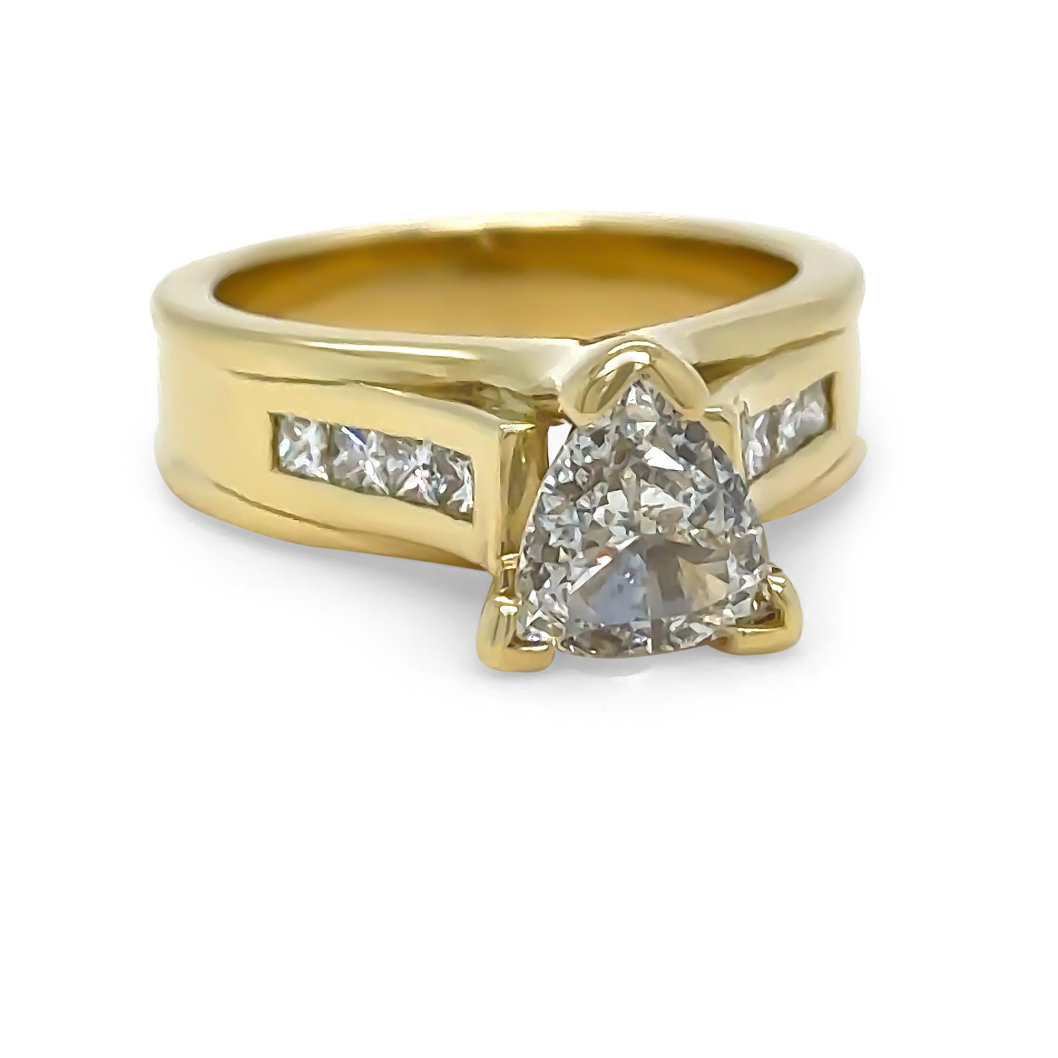 A Diamond engagement Ring, made of 18ct Yellow Gold, and ring size of M, and weighing 10gm. Stamped: 750.

Set with a Single Triangle, brilliant cut Diamond, colour G, and clarity SI1. Weighing 1.00 ct. Certificate provided from GIA. With Report