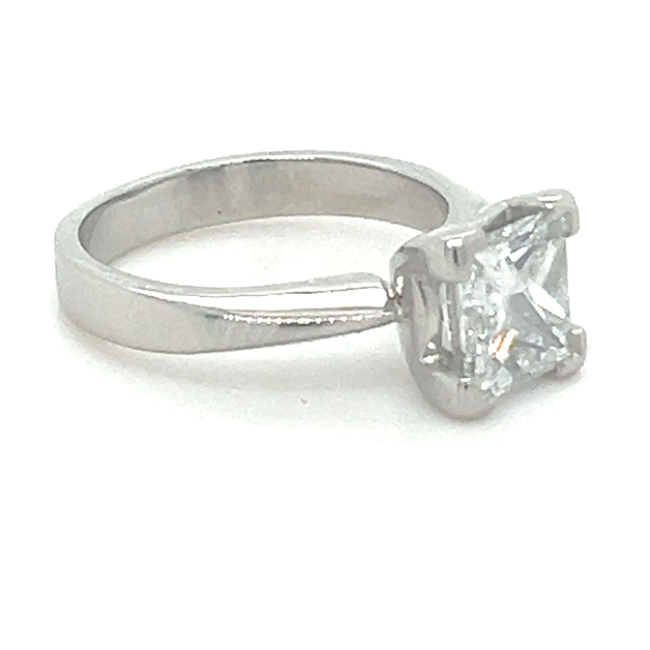 A GIA Solitaire Square Princess Cut Diamond Ring, four claw set in platinum on a 3.2mm reverse tapered band

GIA report 16315644 dated 8/10/2007:- Measurements : 7.33 x 6.99 x 4.94mm, Depth: 70.7% 

Fluorescence: None, Girdle thickness: Extremely