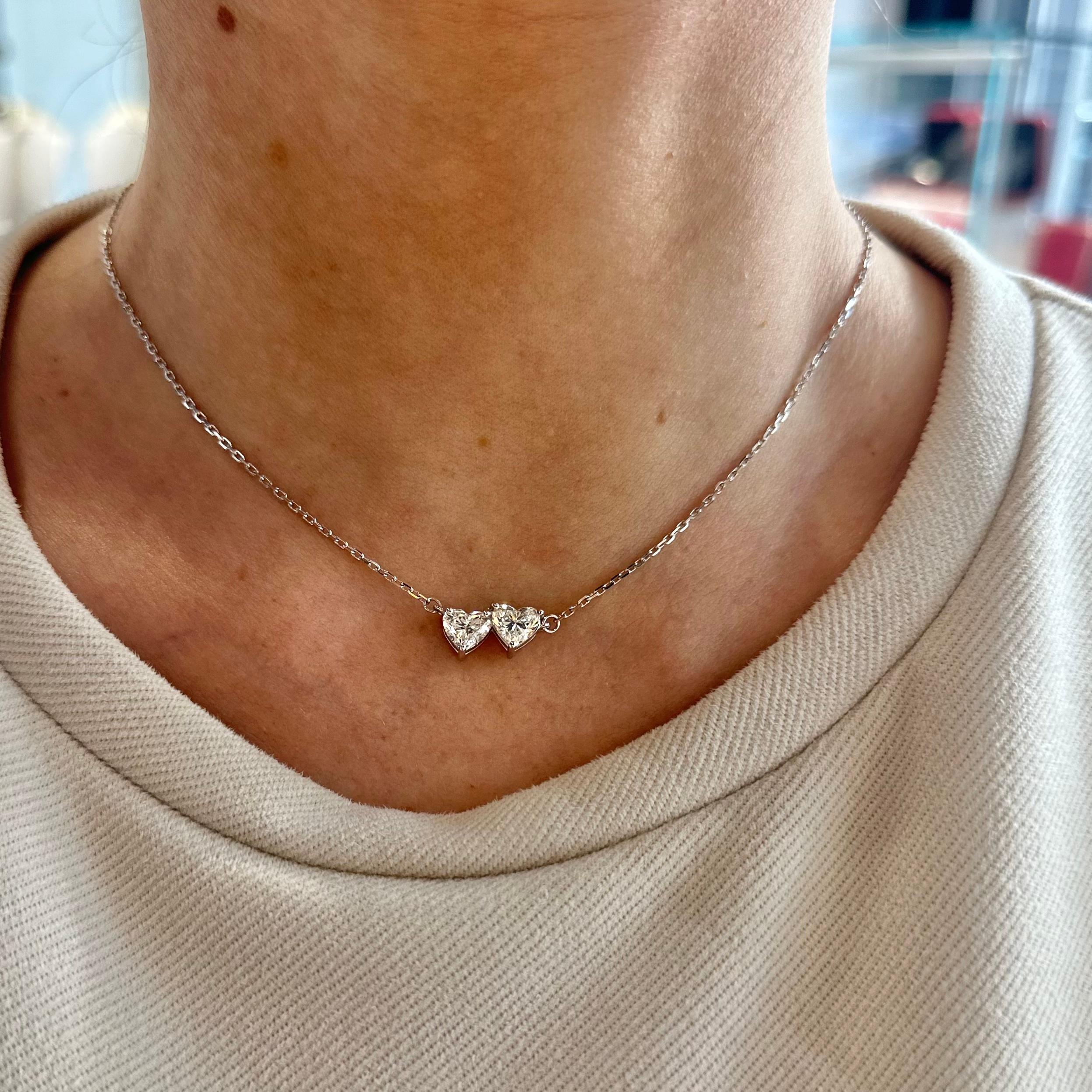Style: Diamond Hearts Necklace

Metal: White Gold 

Metal Purity: 18K

Stones: Diamonds​​​​​​​

Diamond Clarity: SI2

First Stone Carat Weight: 0.96 ct

Second Stone Carat Weight: 0.91 ct

Total Carat Weight: 1.2 ct 

Chain Length: 16 in

Total