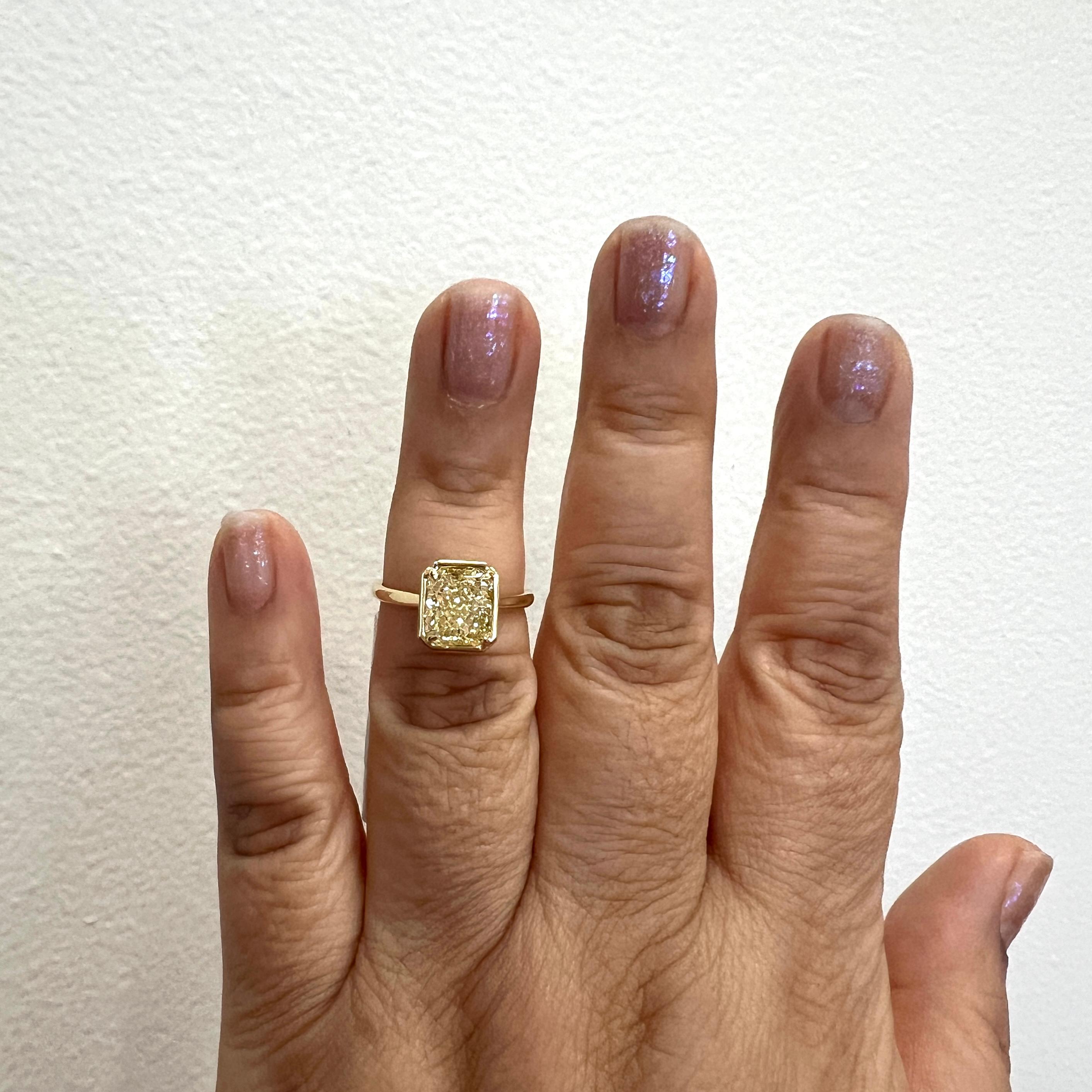 Gorgeous 3.02 ct. W to X VS1 diamond radiant.  Handmade in 18k yellow gold.  Ring size 6.75.  Comes with GIA certificate.