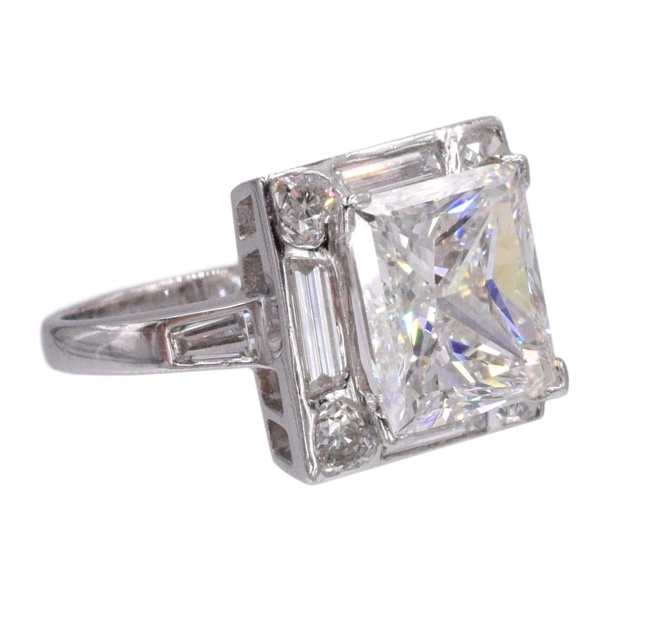 NALLY Diamond engagement  ring in platinum.Center of the ring set with 4.01ct princess cut diamond, color G, clarity VS1, GIA#8440332. Placed in a platinum mounting set with four trapezoid cut diamonds weighing total of 0.73ct, four heart shaped