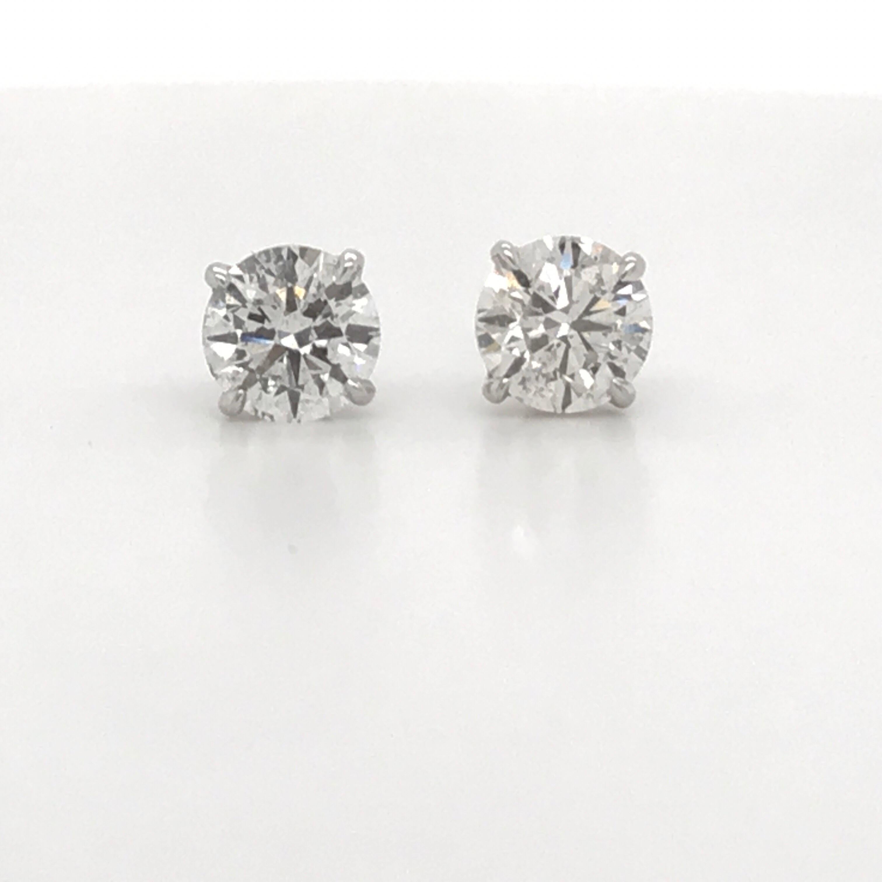 GIA Diamond stud earrings weighing 2.16 carats in an 18k white gold 4 prong champagne setting.
Color H-I
Clarity I1
