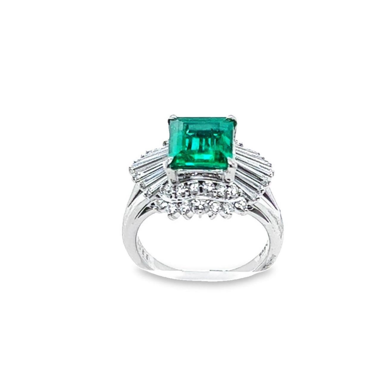 GIA Certified Colombian Emerald and diamond ballerina-style cocktail ring crafted in platinum.  The center stone is a square-shaped vibrant green emerald weighing 2.07 carats. 1.18 carats of mixed shape, G/H color, and VS clarity diamonds surround