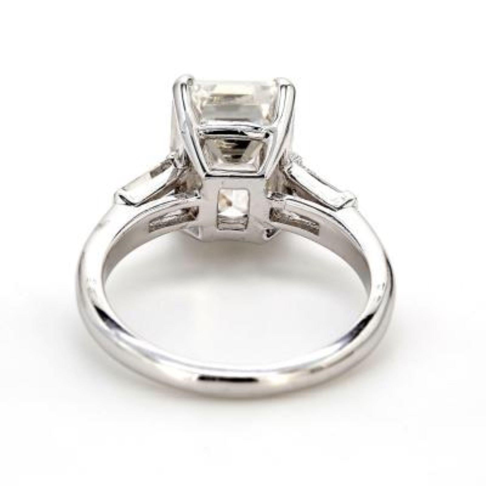 Modern GIA Emerald cut diamond engagement ring For Sale