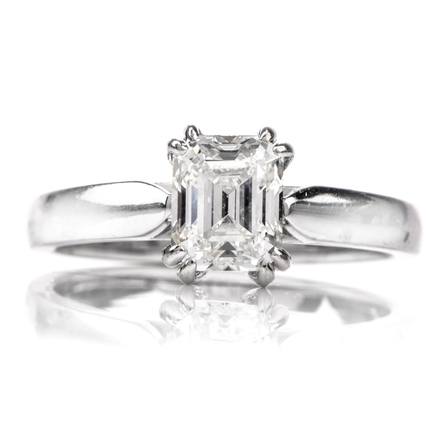 his  classic Solitaire engagement ring crafted in 14k white gold. It exposing an emerald-cut diamond, gia certified  weighing 1.15 carats, and is graded I  color and VS1 clarity, prong set. The sparkling diamond engagement ring remains in excellent