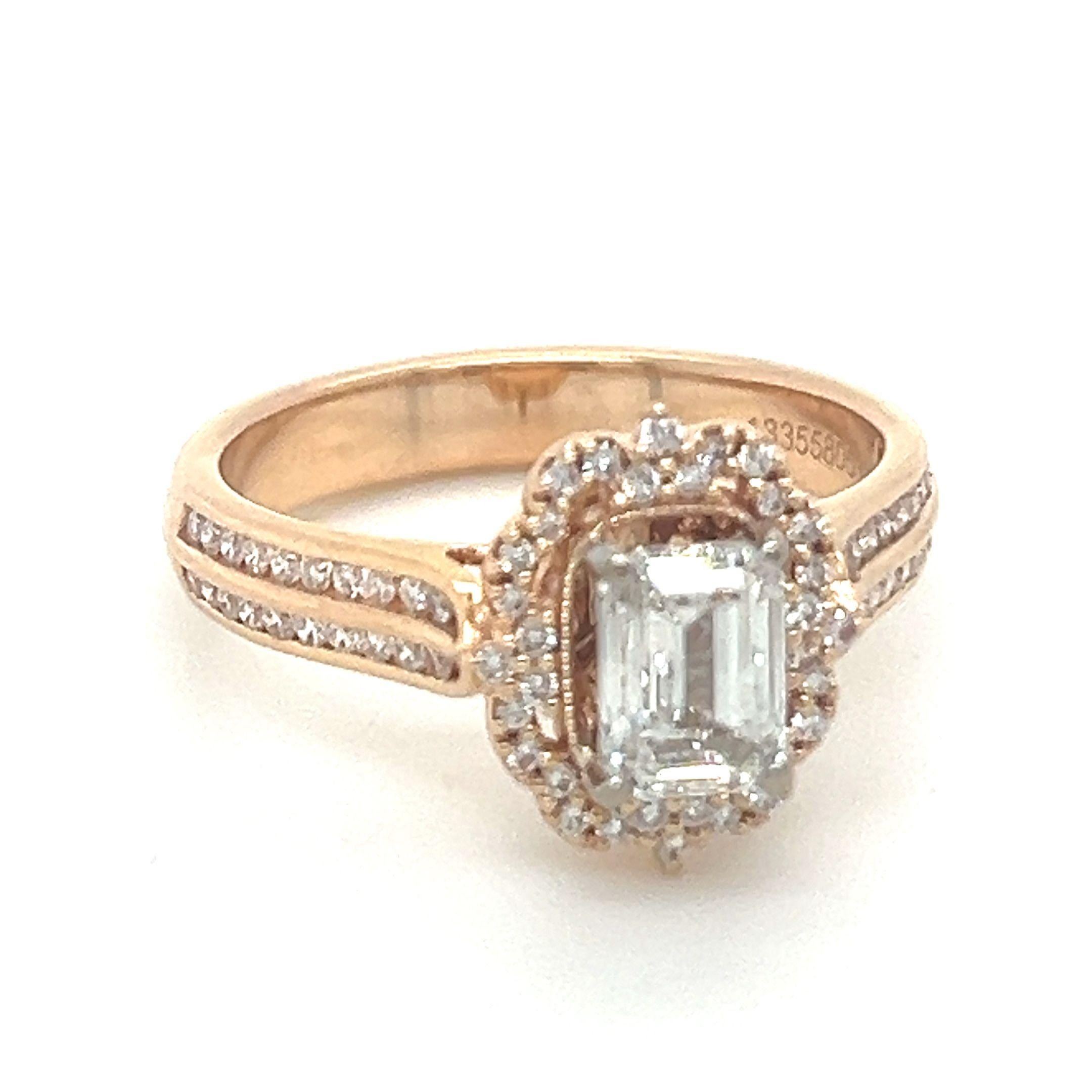 A GIA Emerald Cut Diamond Cluster Ring, four claw set in 18ct rose gold within a border of 32 round brilliant cut diamonds and with 40 round brilliant cut diamonds channel set in two rows down the shoulders on a 3.5mm band.

GIA report 1335580532