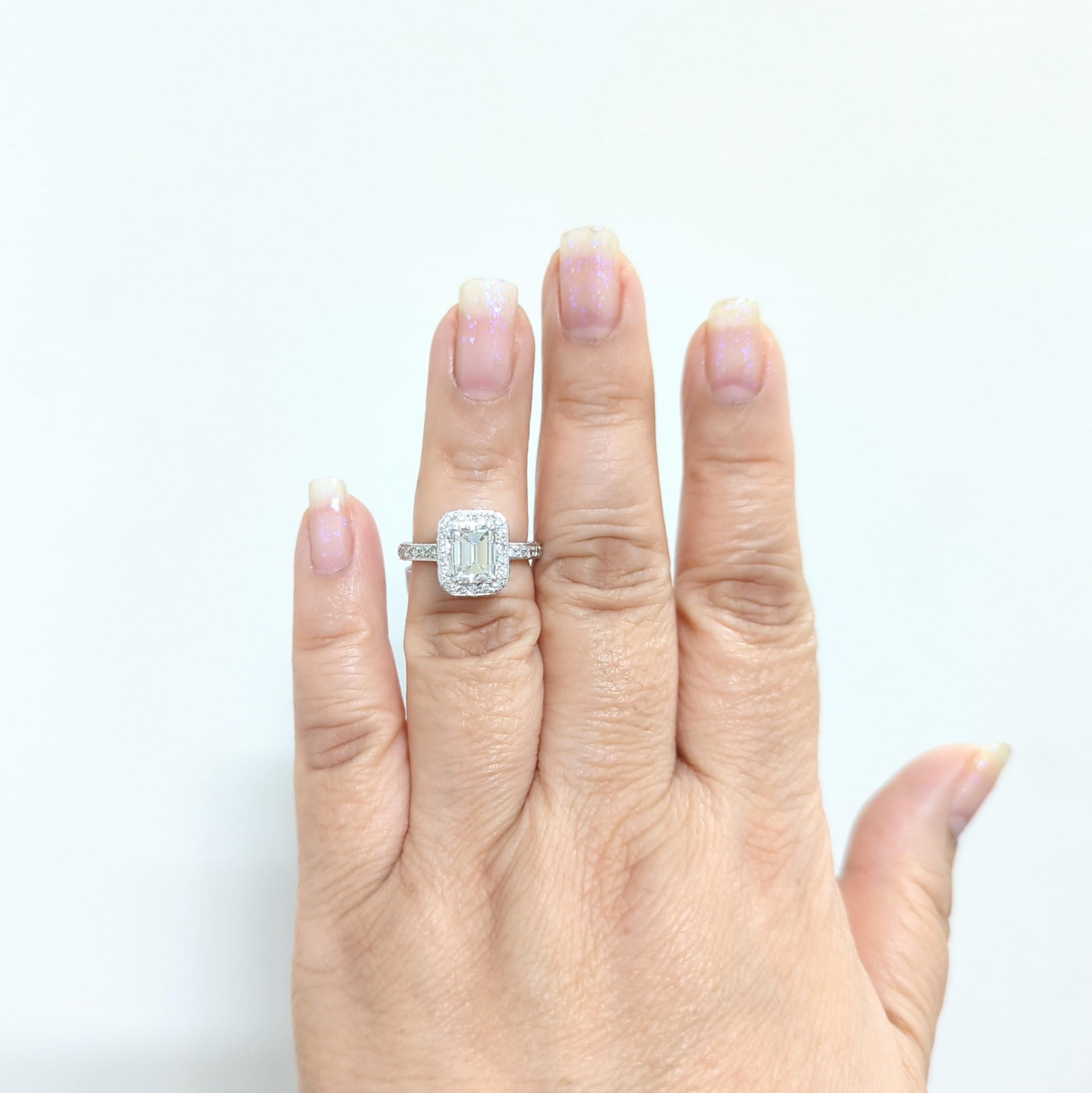 Beautiful GIA 2.00 ct. emerald cut E color and VS1 clarity with good quality white diamond rounds as accents.  Handmade in 18k white gold.  Ring size 6.5.  GIA certificate is included.