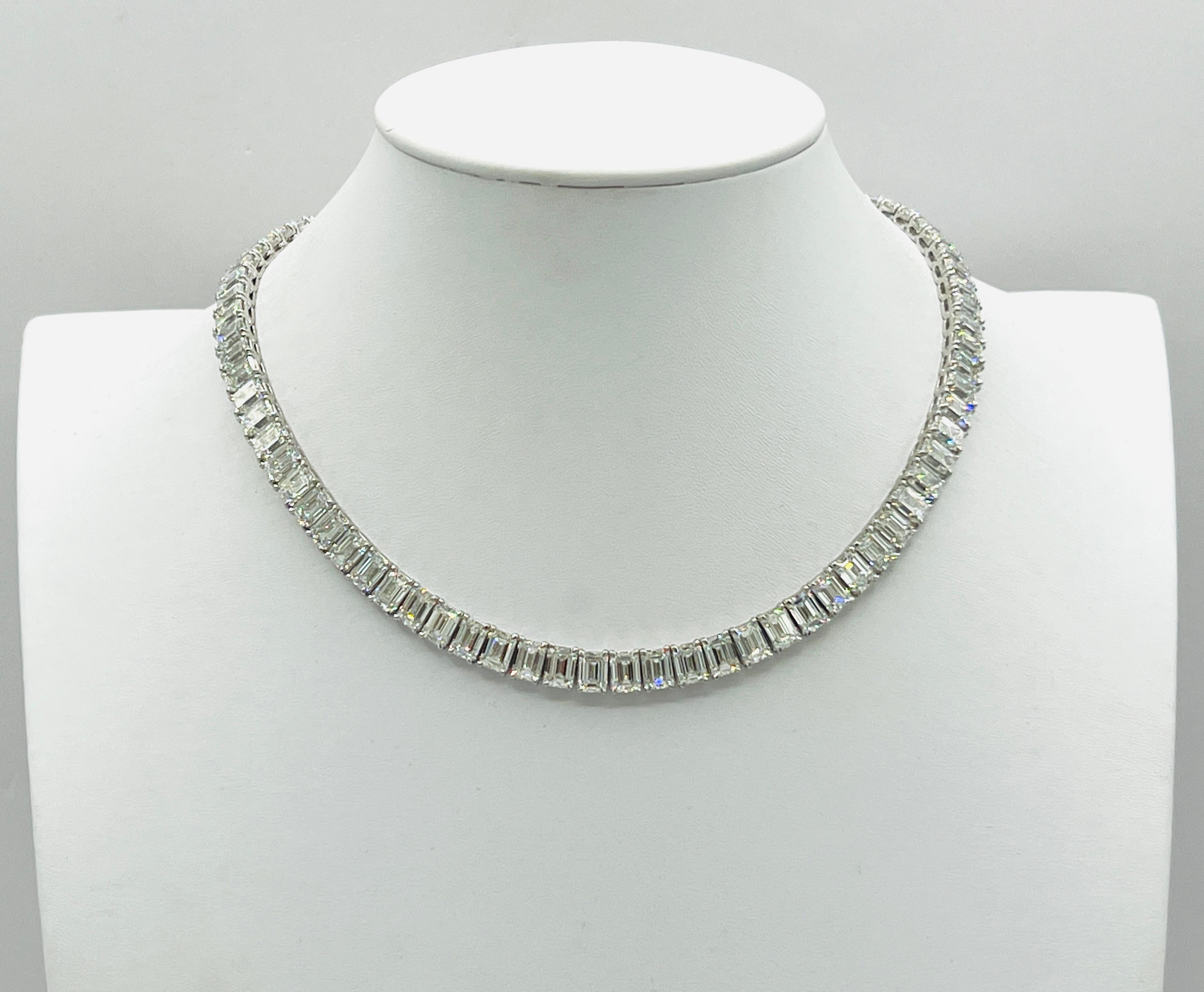 Gorgeous 56.14 ct. FG IF-VS2 white diamond emerald cuts.  Total of 80 stones.  Handmade in 18k white gold.  Length is 15