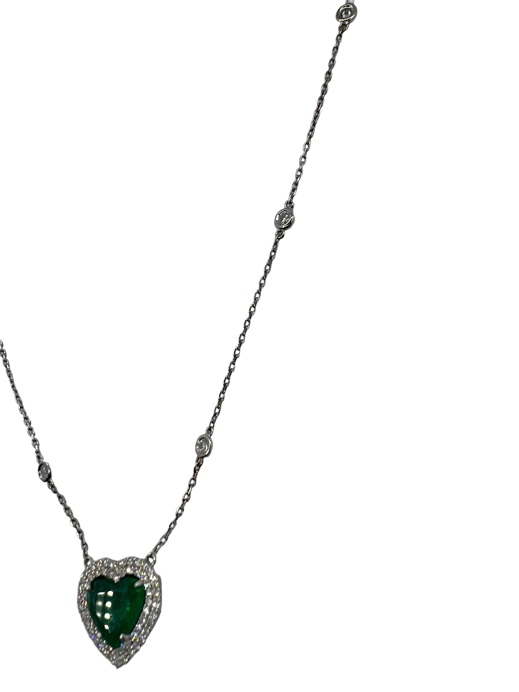 GIA Certified 2.56cts heart cut Emerald set in an 18k white gold Double Diamond Halo. On a Diamonds by the yard chain. 10 diamonds on a 14k white gold Chain. GIA certification is in photos with additional details. 1.50 ctw in Diamonds. Necklace
