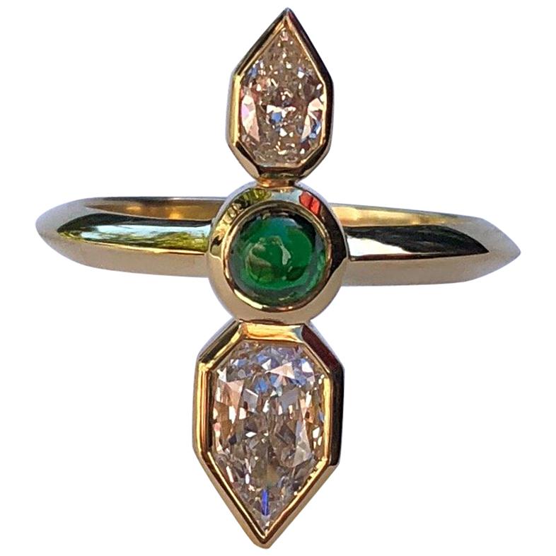 This ring is like an arrow on your finger. Made by hand (hand fabricated) in California with reclaimed and refined 18 karat gold, using a Tsavorite cabochon from Bridges Tsavorite in Kenya, and 2 Empress cut diamonds:  G-VS2/0.54 carat and