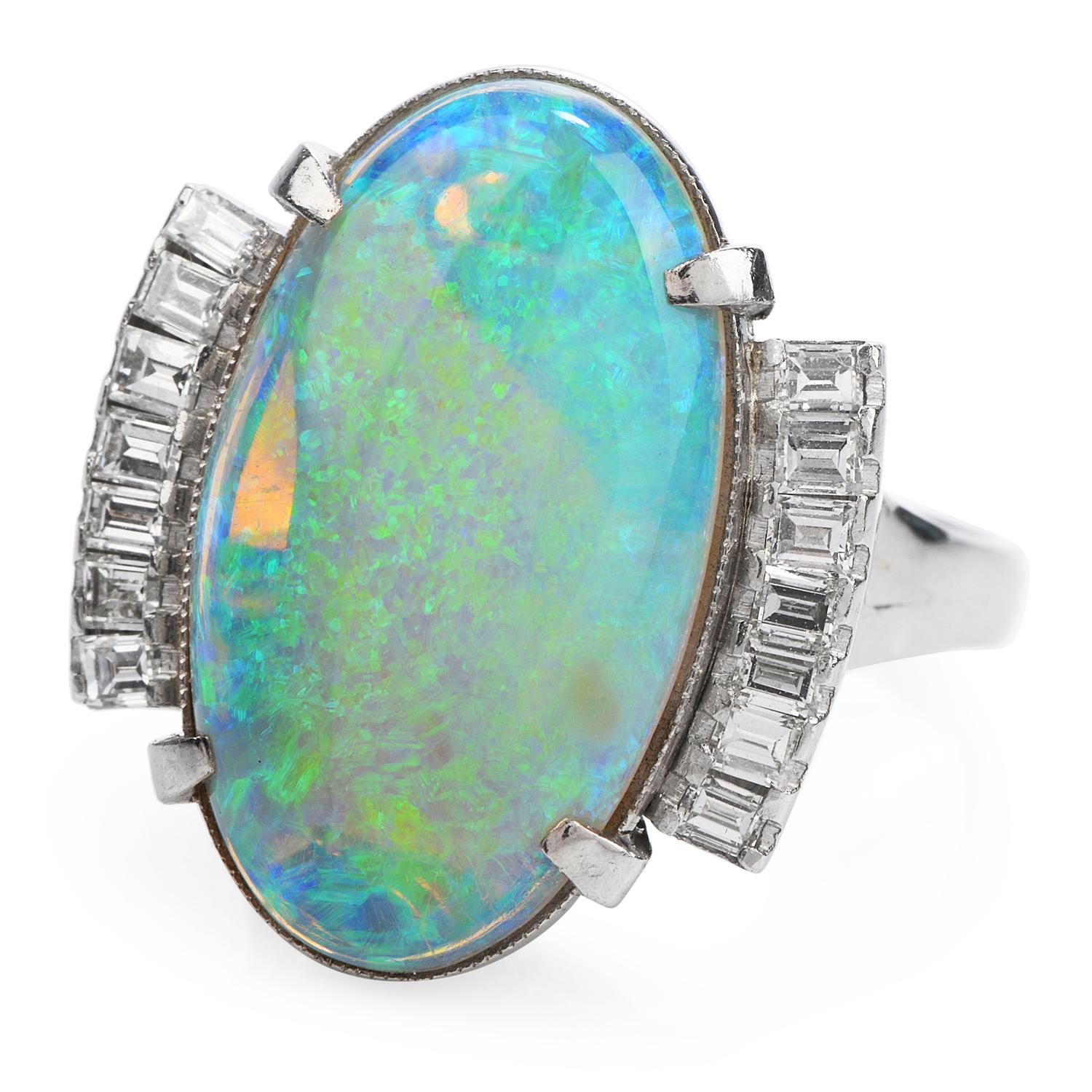 A Cocktail ring is worth more than a thousand Words!

 Crafted in Solid Platinum,

Weighing 11.1 grams and measuring 19 mm x 21 mm, 11 mm high,

The Color Display in this GIA Certified White Semi-Transparent Opal is Deep and Endless, shaped in Oval