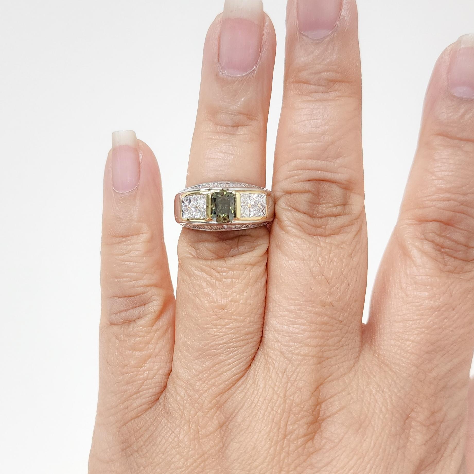 Gorgeous 1.01 ct. green diamond cushion with white diamond squares and baguettes.  Handmade mounting in platinum and 18k yellow gold.  GIA certificate included.  Ring size 7.
