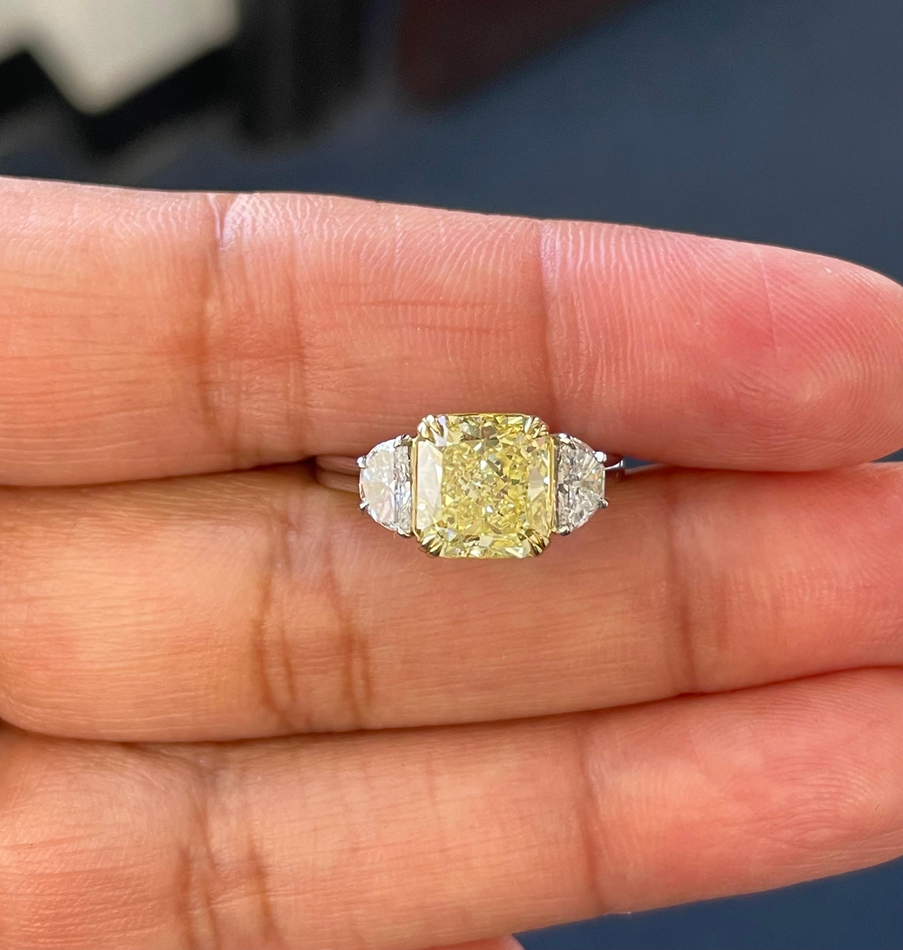 Radiant Cut GIA Fancy Intense Yellow Diamond Radiant Three Stone Ring in Platinum and 18k For Sale