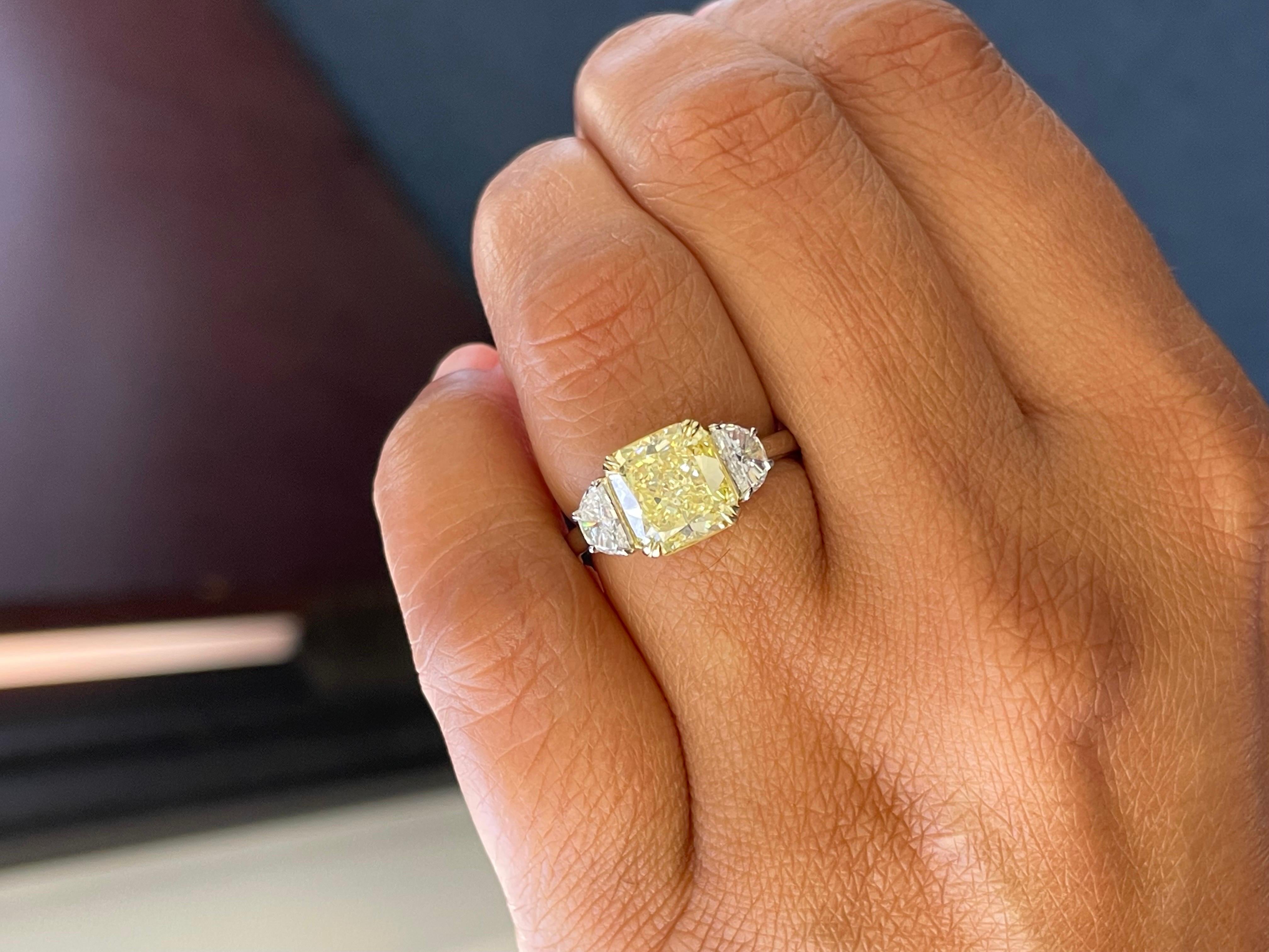 GIA Fancy Intense Yellow Diamond Radiant Three Stone Ring in Platinum and 18k In New Condition For Sale In Los Angeles, CA